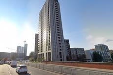 Woman survives 40ft plunge from third-floor balcony as man arrested after 2am fall