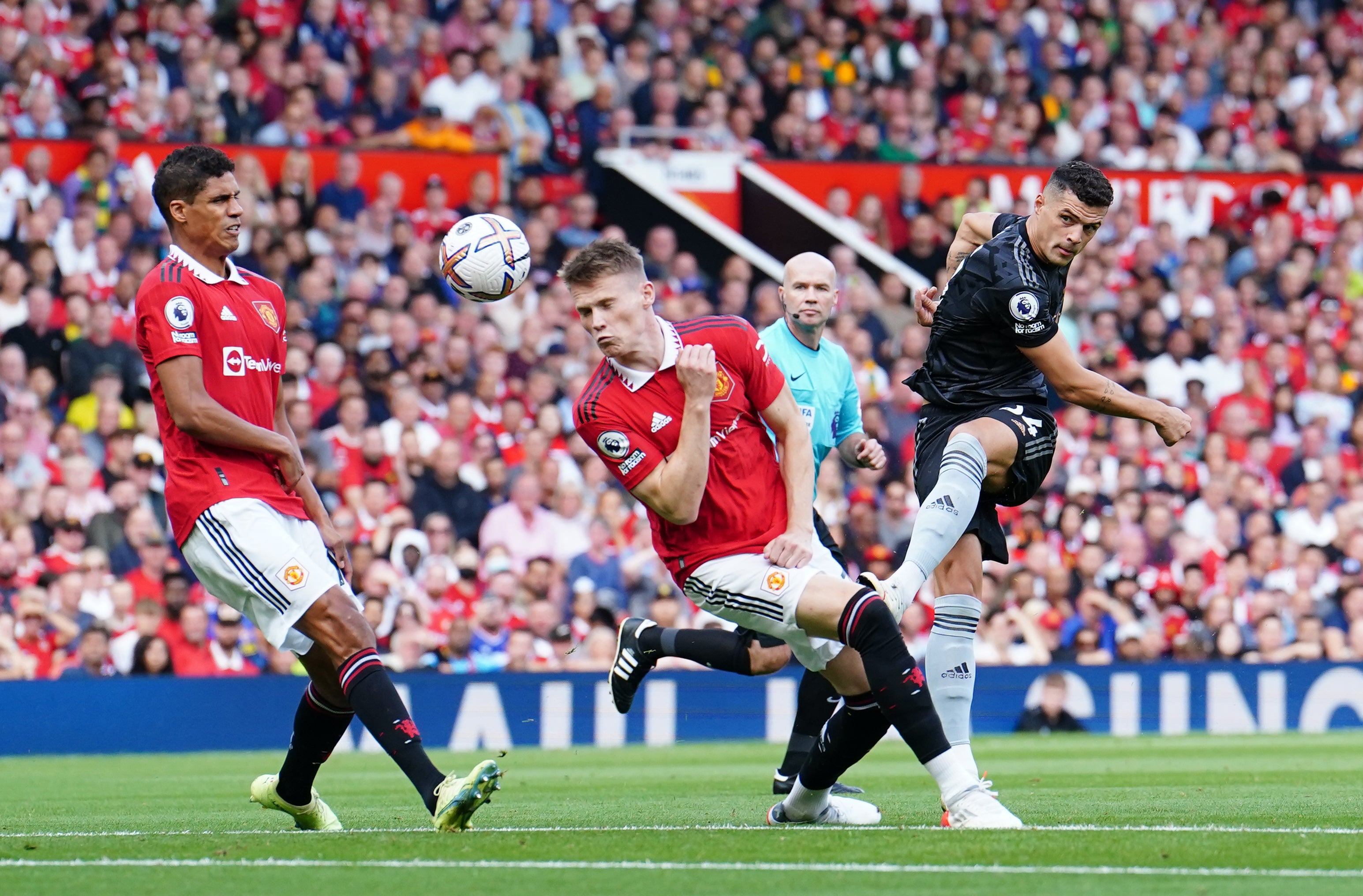 Arsenal’s Granit Xhaka shoots at goal against United (Martin Rickett/PA)