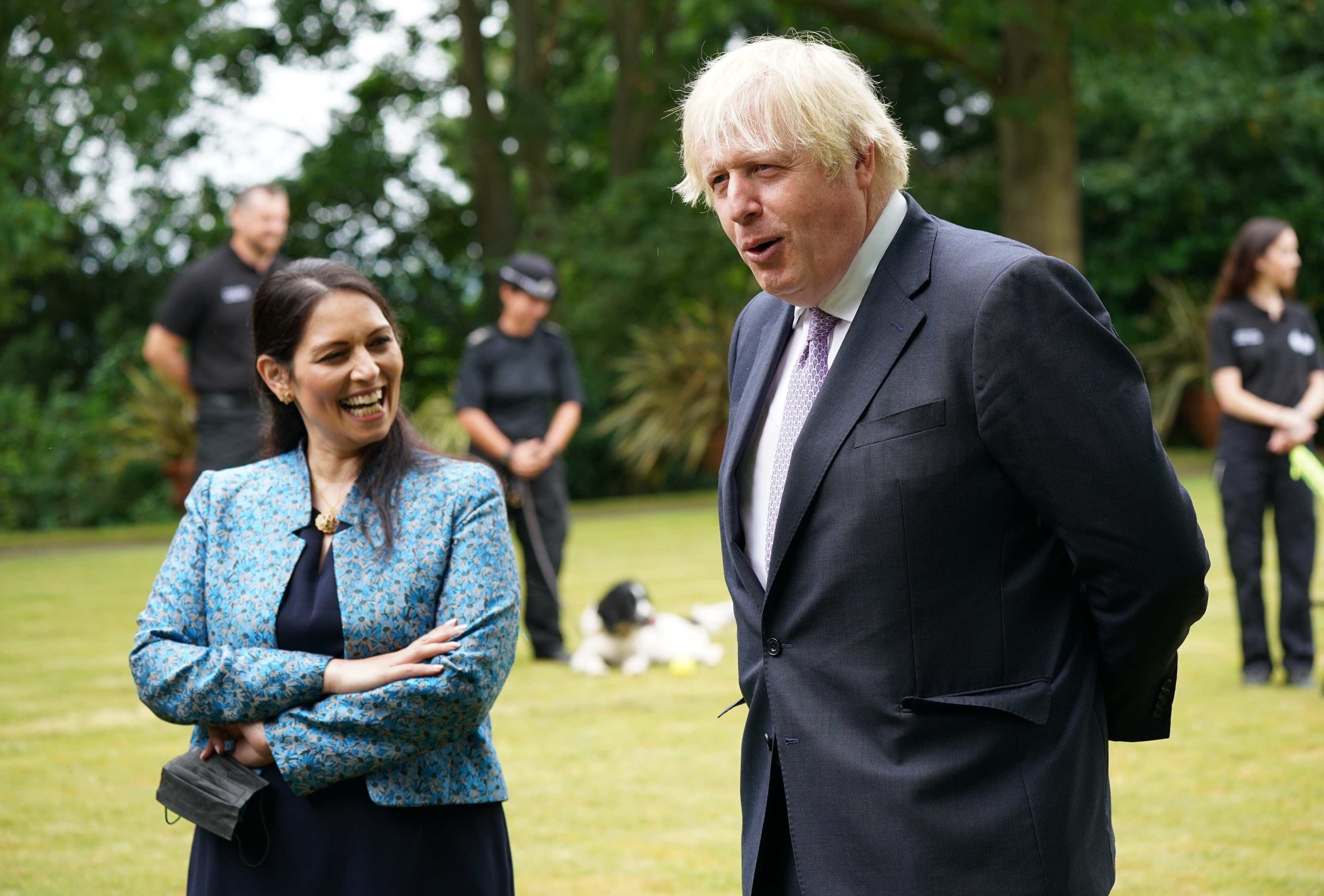 Come unstuck: Boris Johnson and his then home secretary Priti Patel, on a visit to Surrey Police headquarters in Guildford (PA)