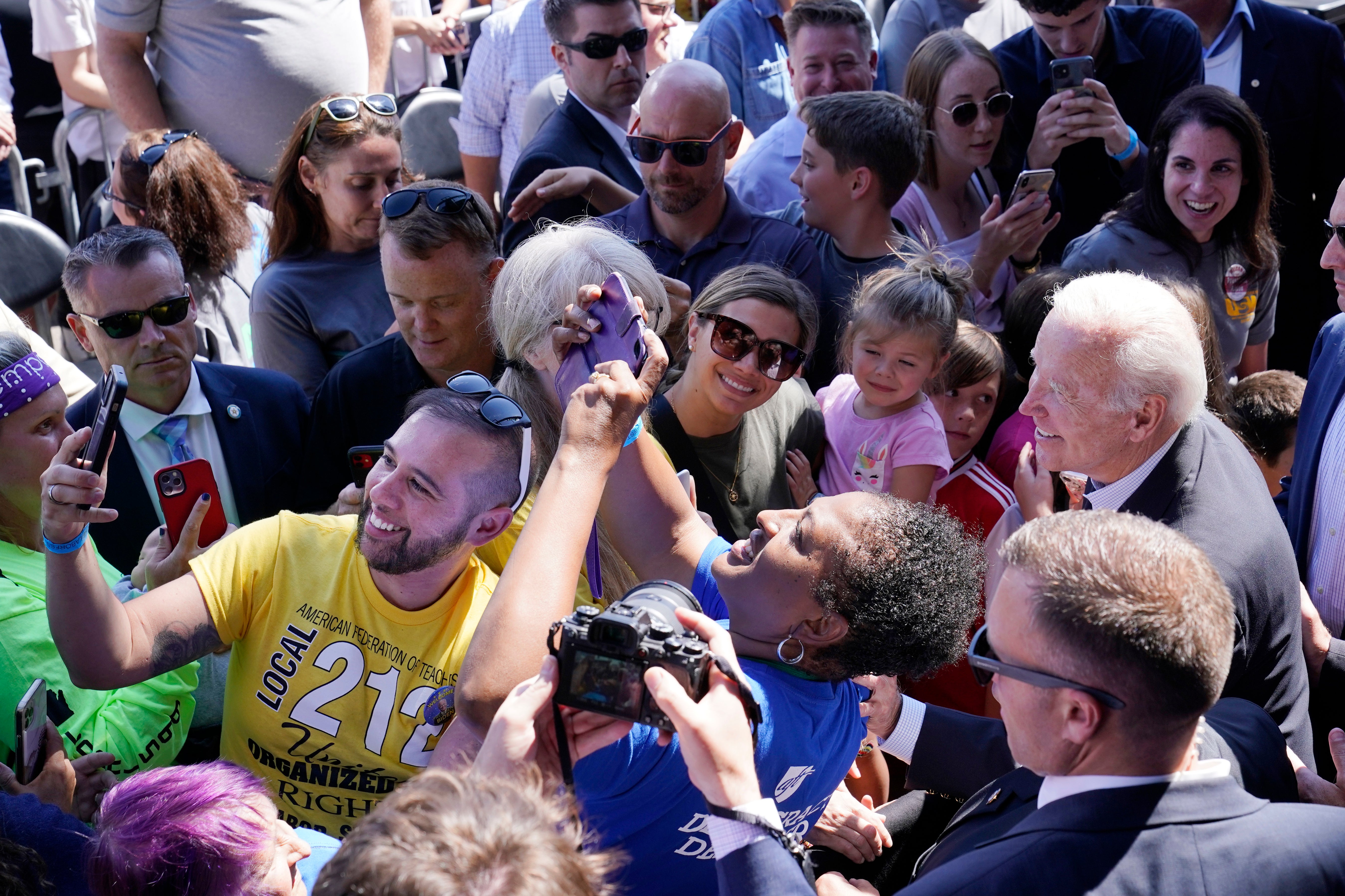 President Joe Biden wades through the crowd after speaking at the Labor Day event in Milwaukee