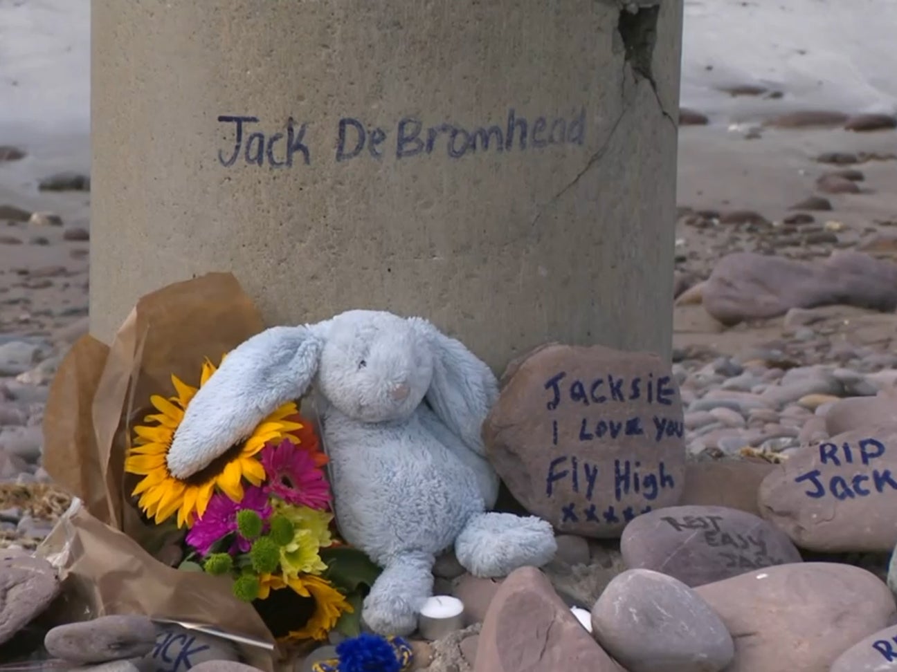 A memorial to Jack has built up on the beach where he had fatal accident