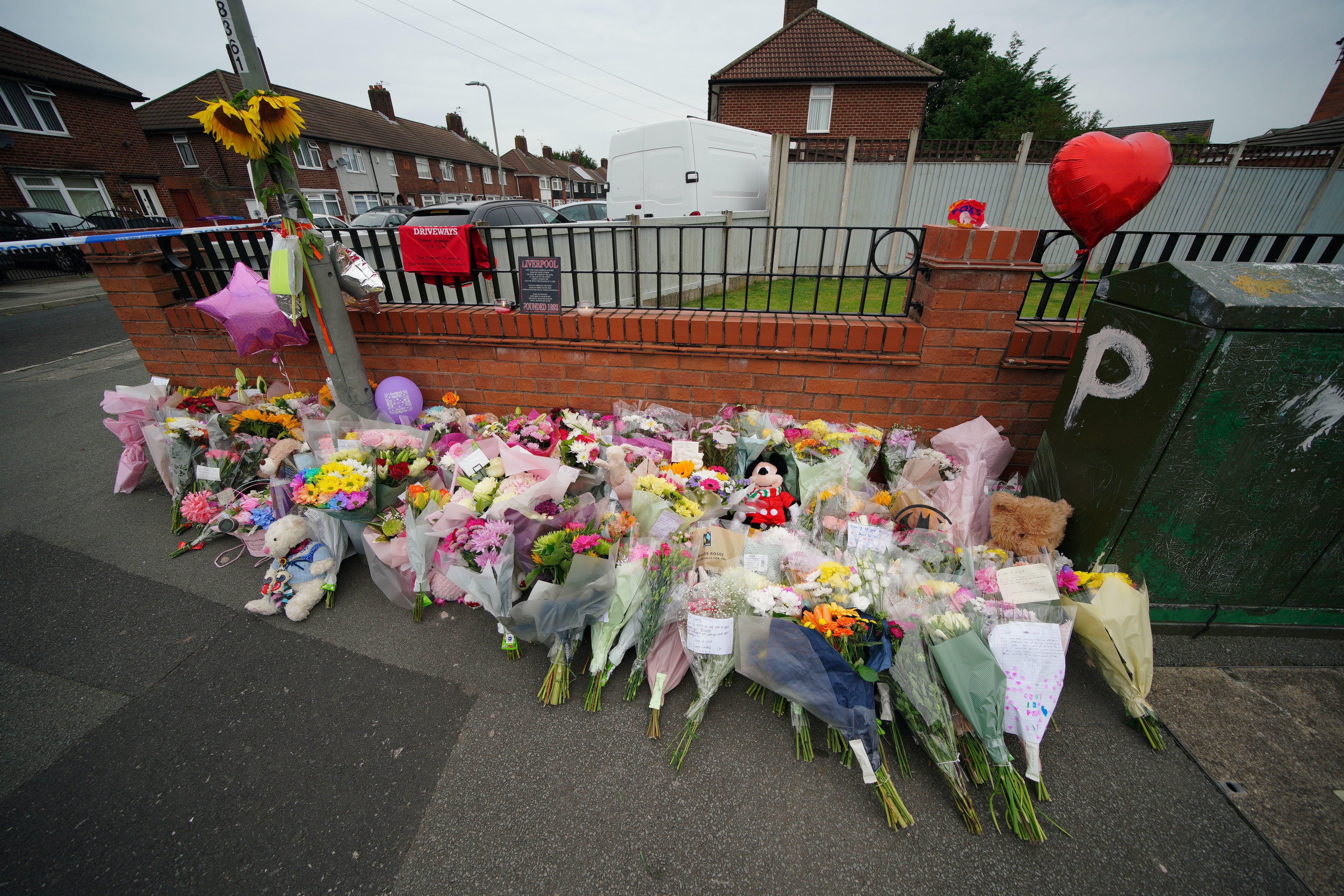 Flowers are left near to the scene of the shooting