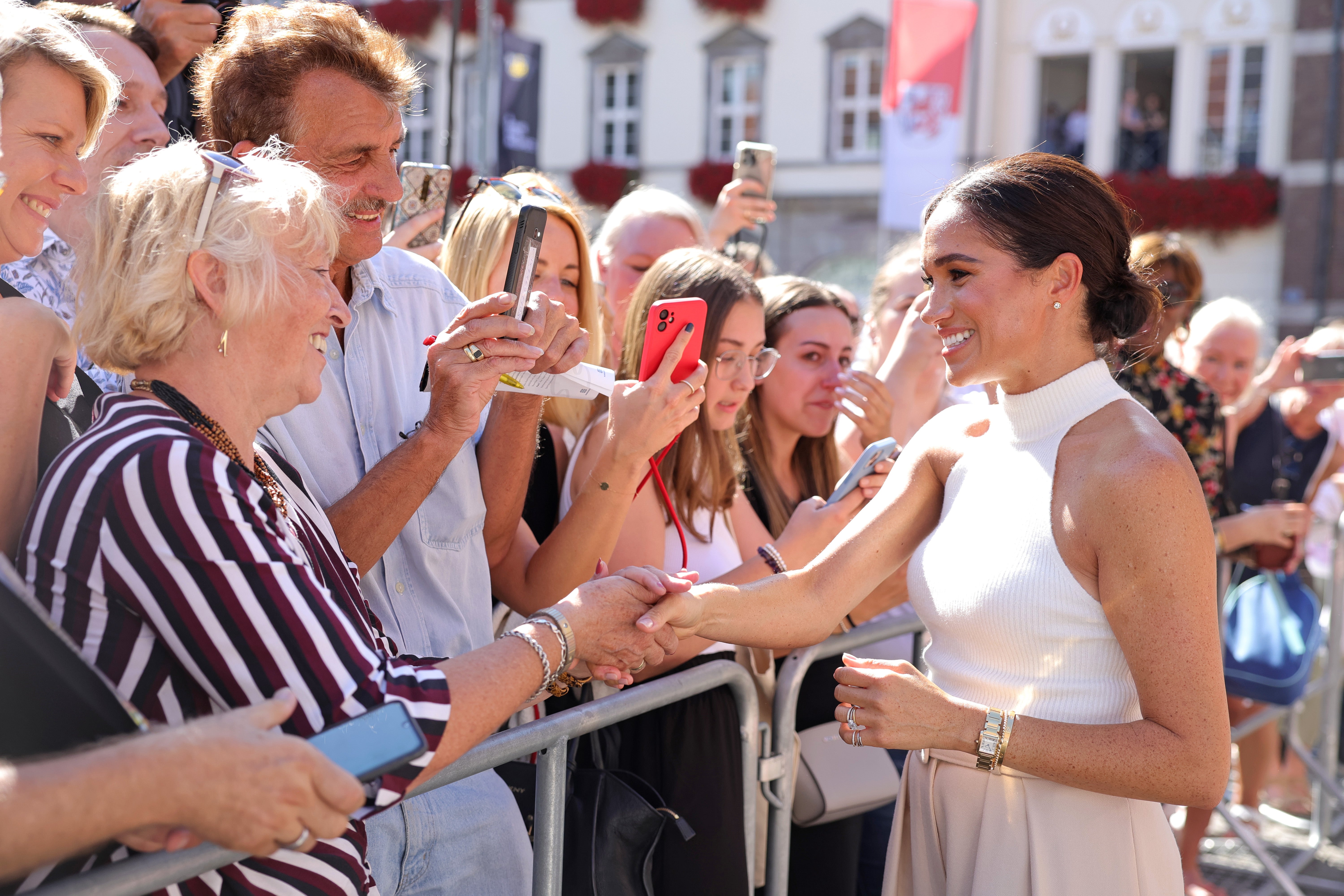 Meghan Markle poses for selfies with fans during visit to Germany