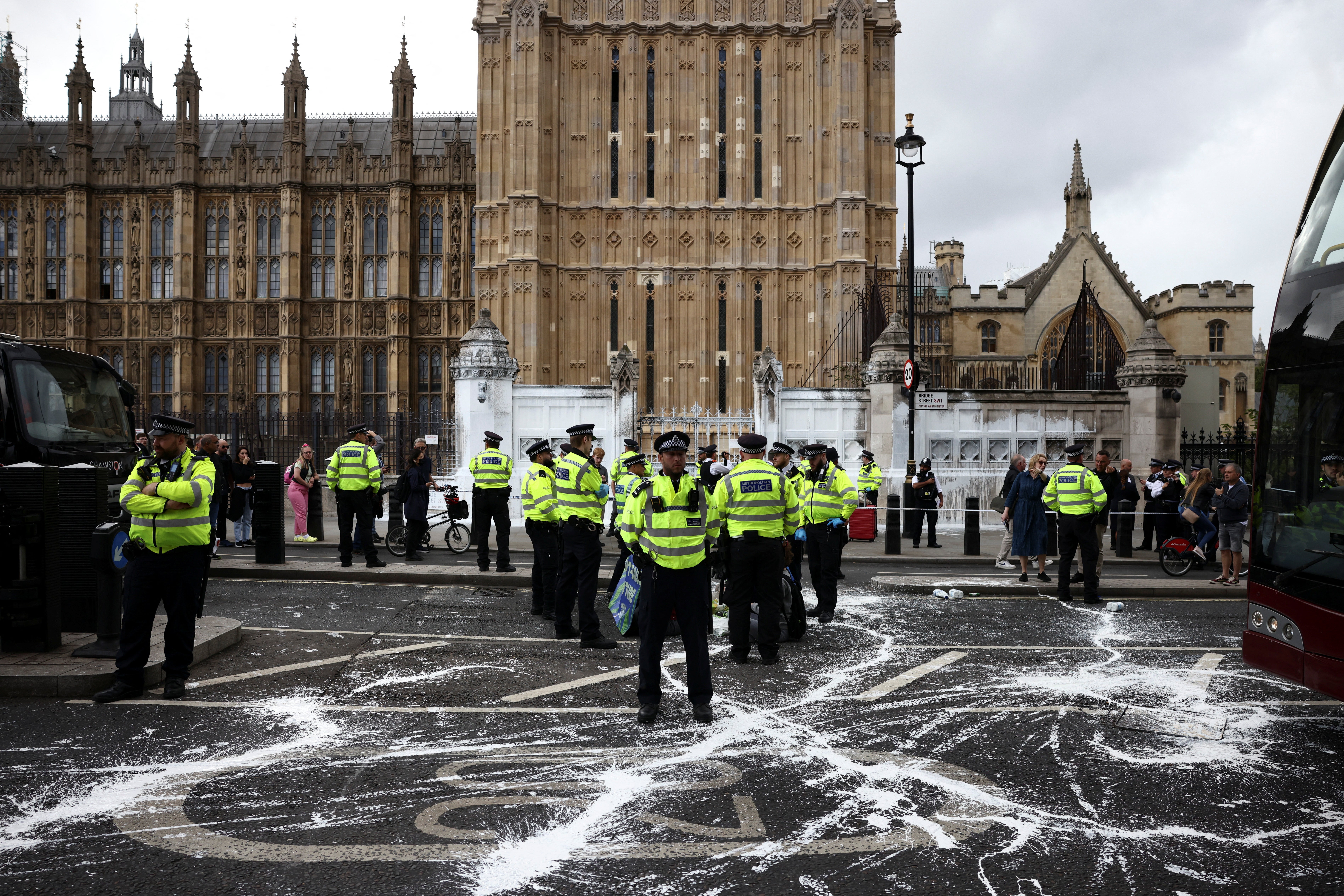 Police officers stand guard outside the Houses of Parliament