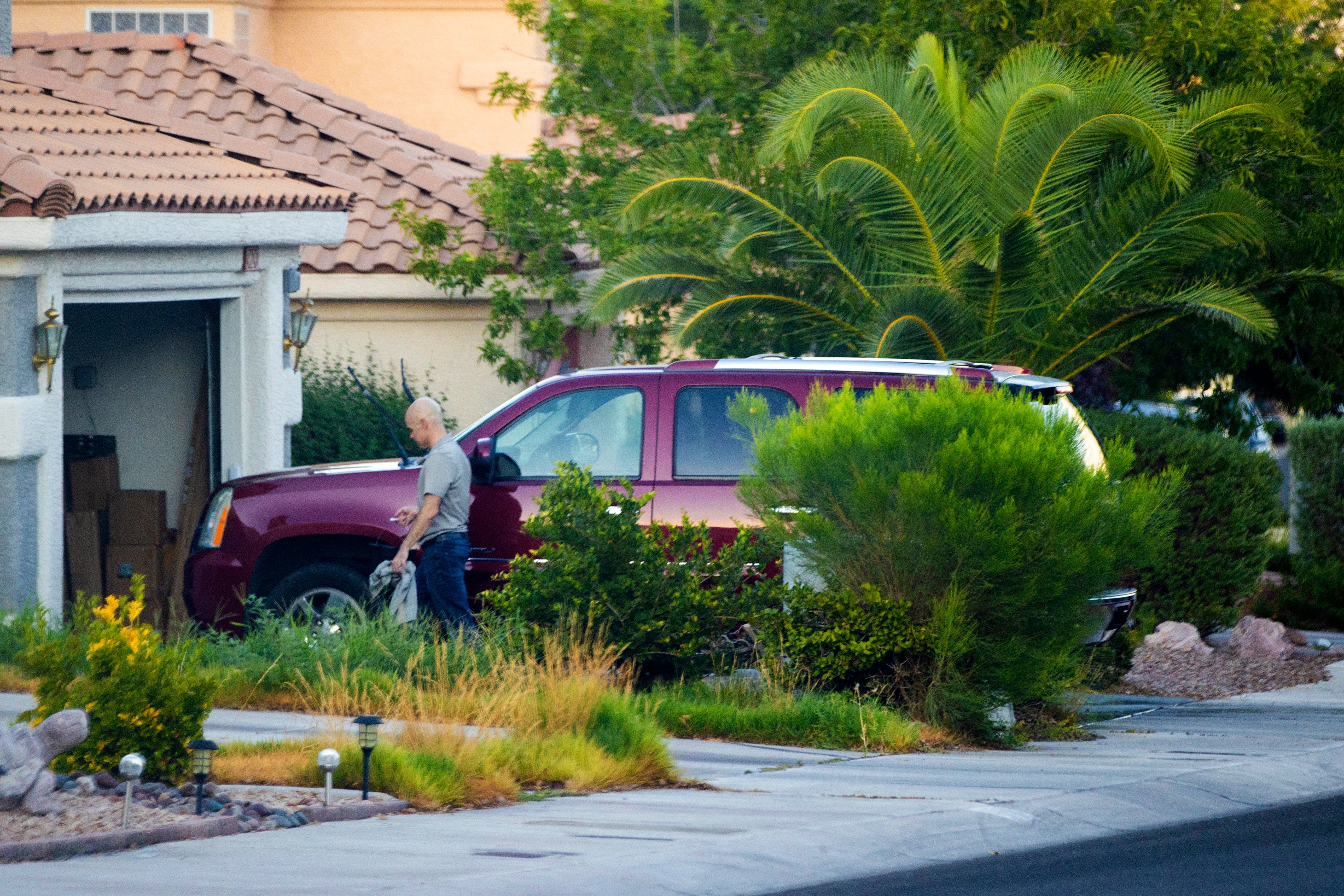 Mr Telles was seen washing the car outside his home