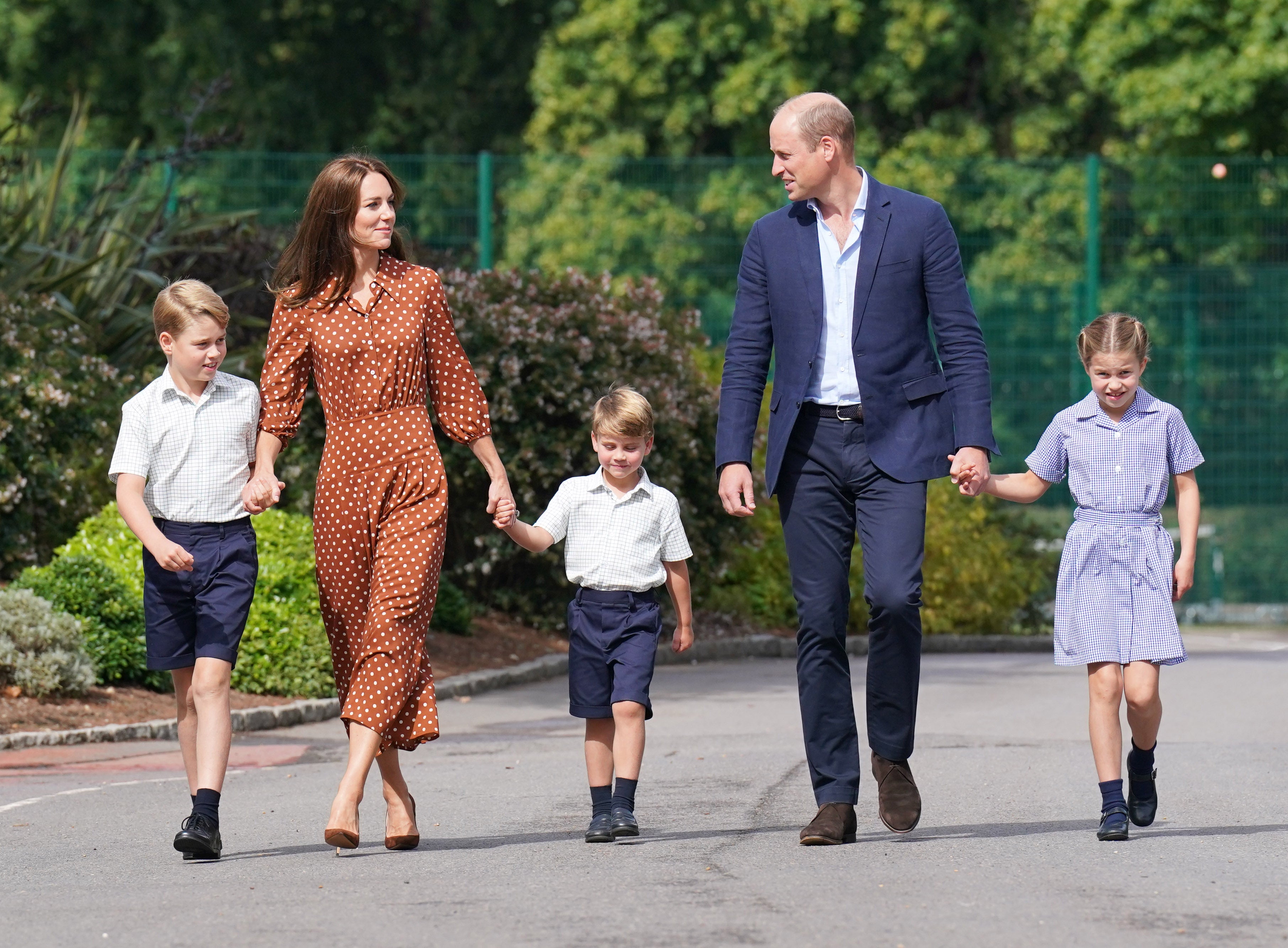 Prince George, Princess Charlotte and Prince Louis (C), accompanied by their parents the Prince William, Duke of Cambridge and Catherine, Duchess of Cambridge