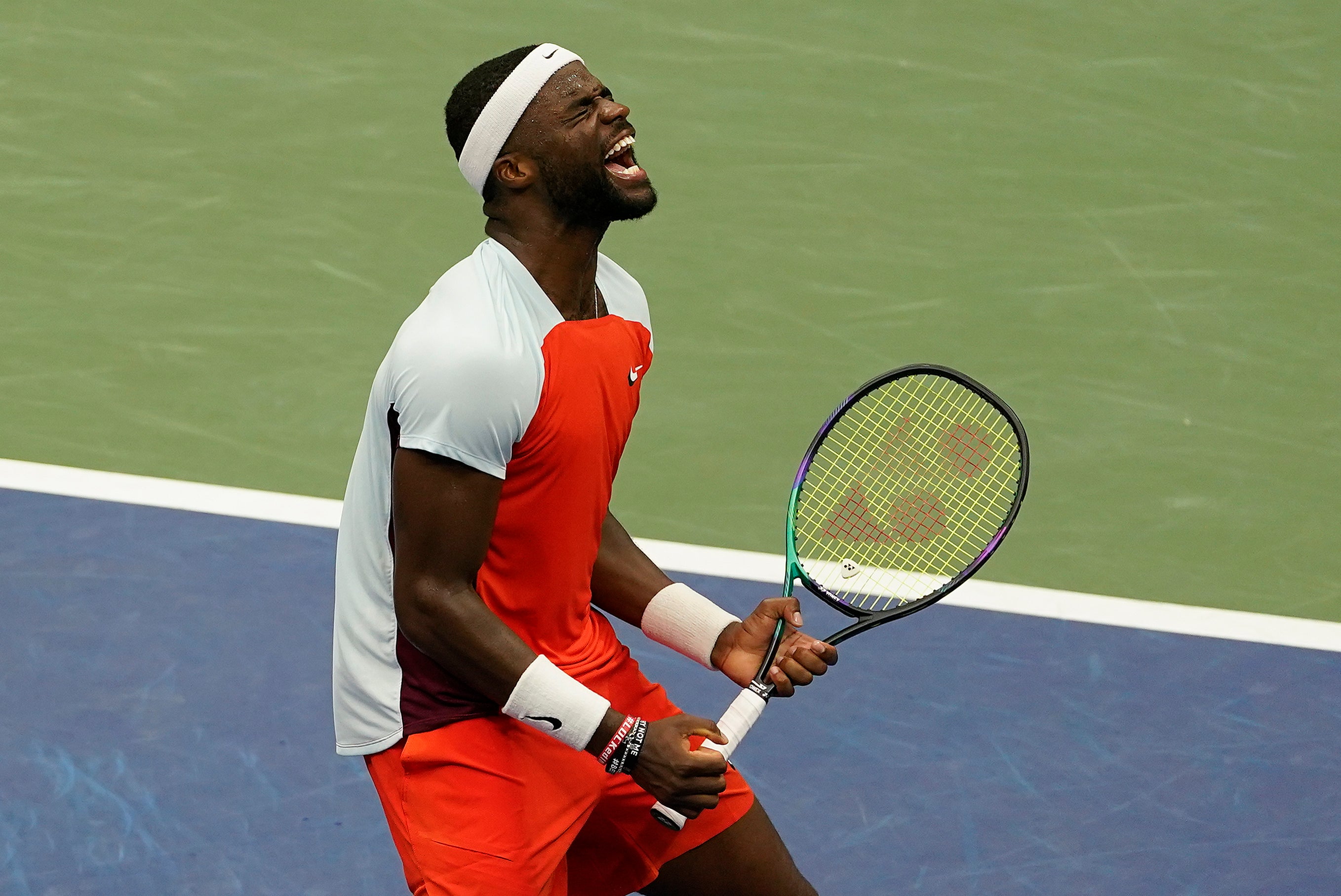 Frances Tiafoe reacts with joy to his victory over Andrey Rublev (Seth Wenig/AP)