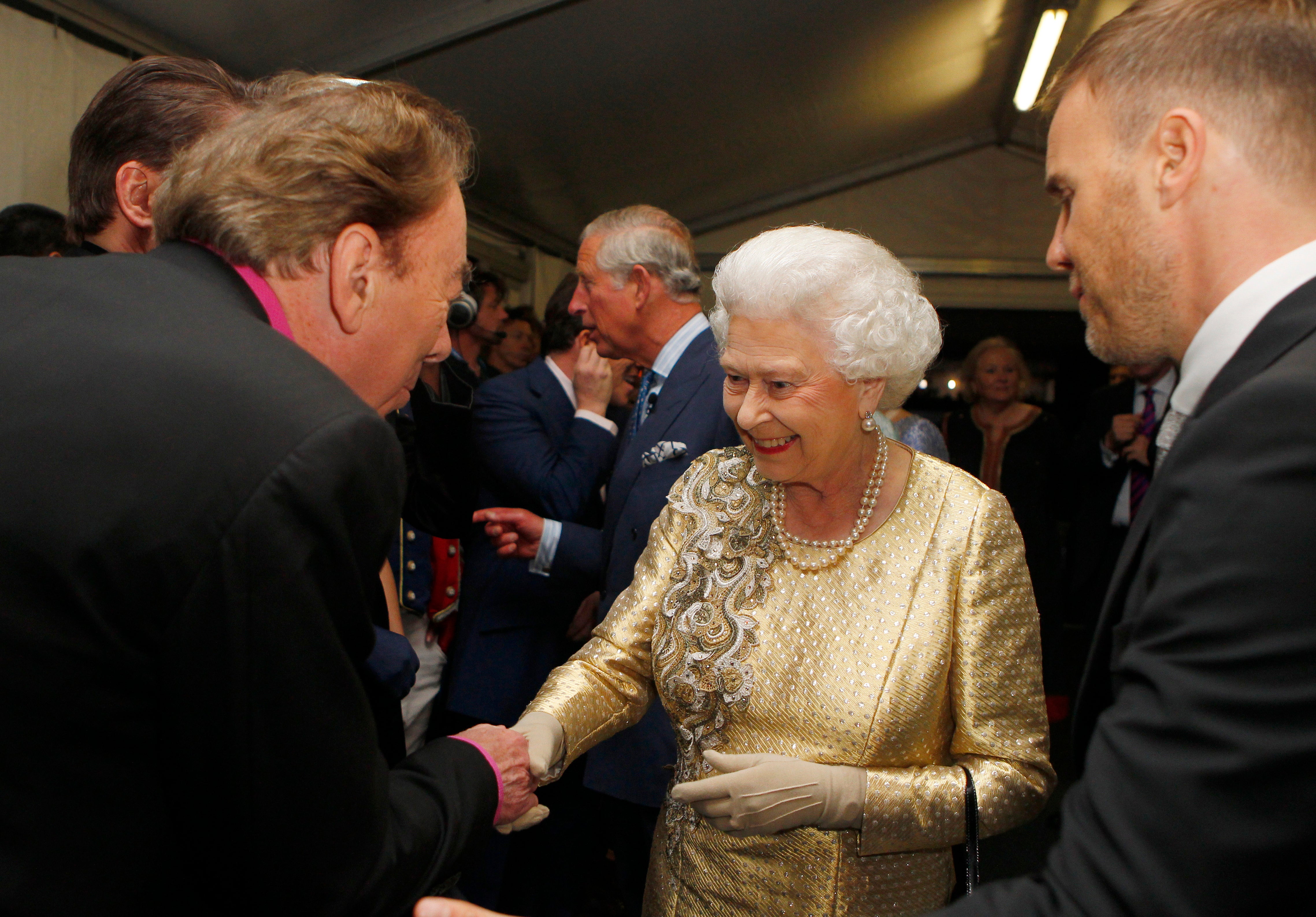 The Queen with Andrew Lloyd Webber and Gary Barlow backstage at the Diamond Jubilee concert in 2012