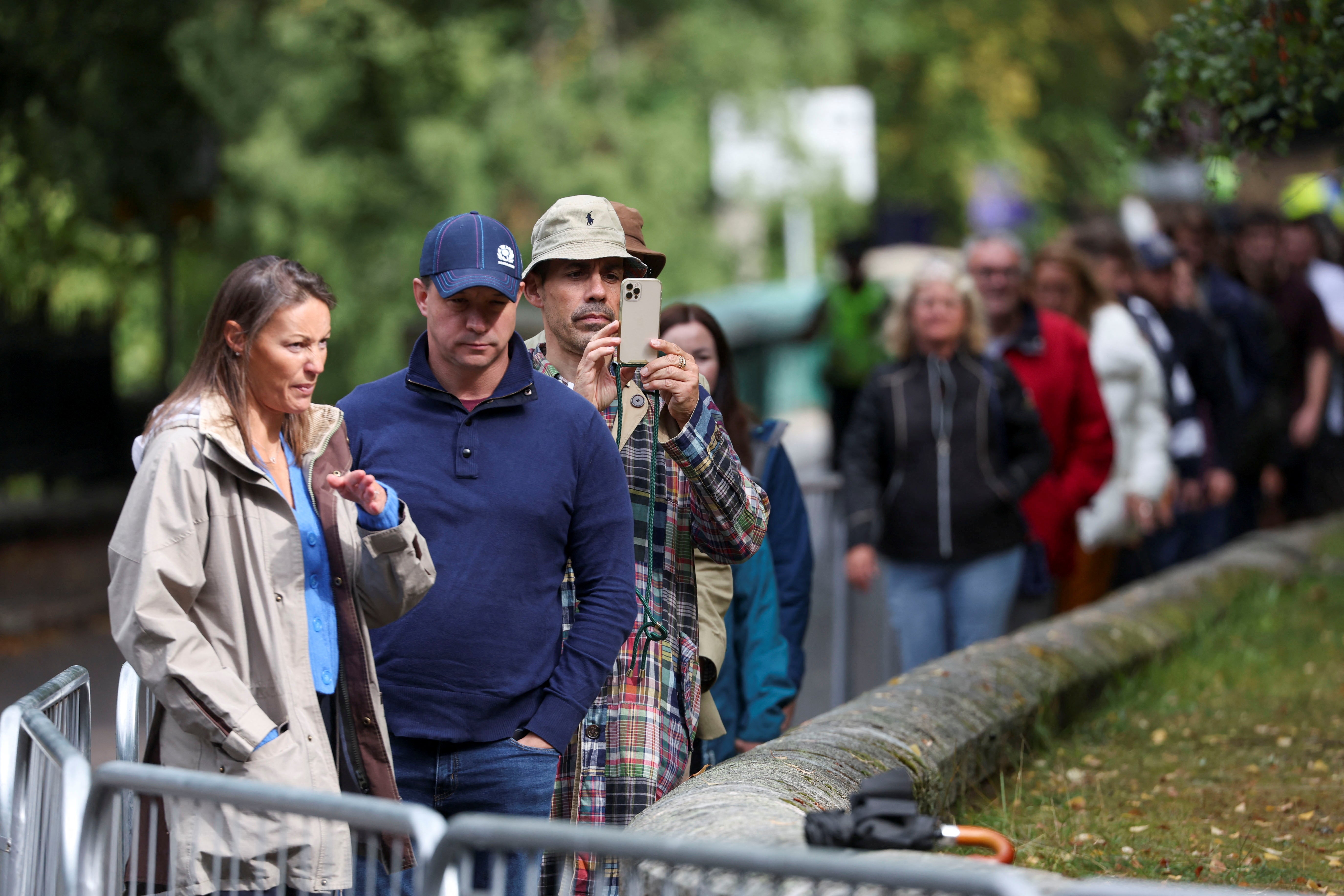 People gather outside Balmoral Castle amid fears for the Queen’s health