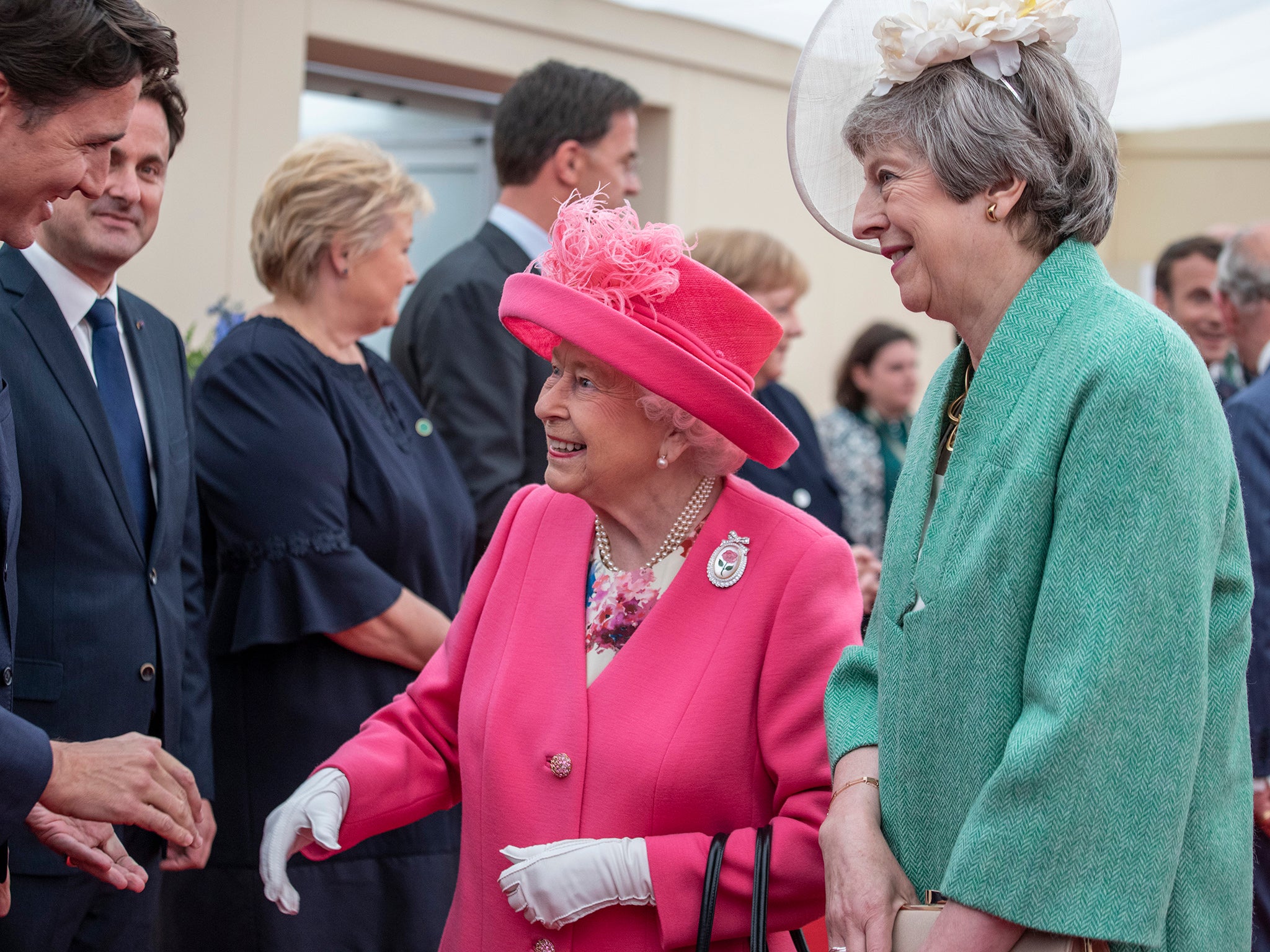 With Canadian PM Justin Trudeau and former British PM Theresa May at an event commemorating the 75th anniversary of the D-Day landings