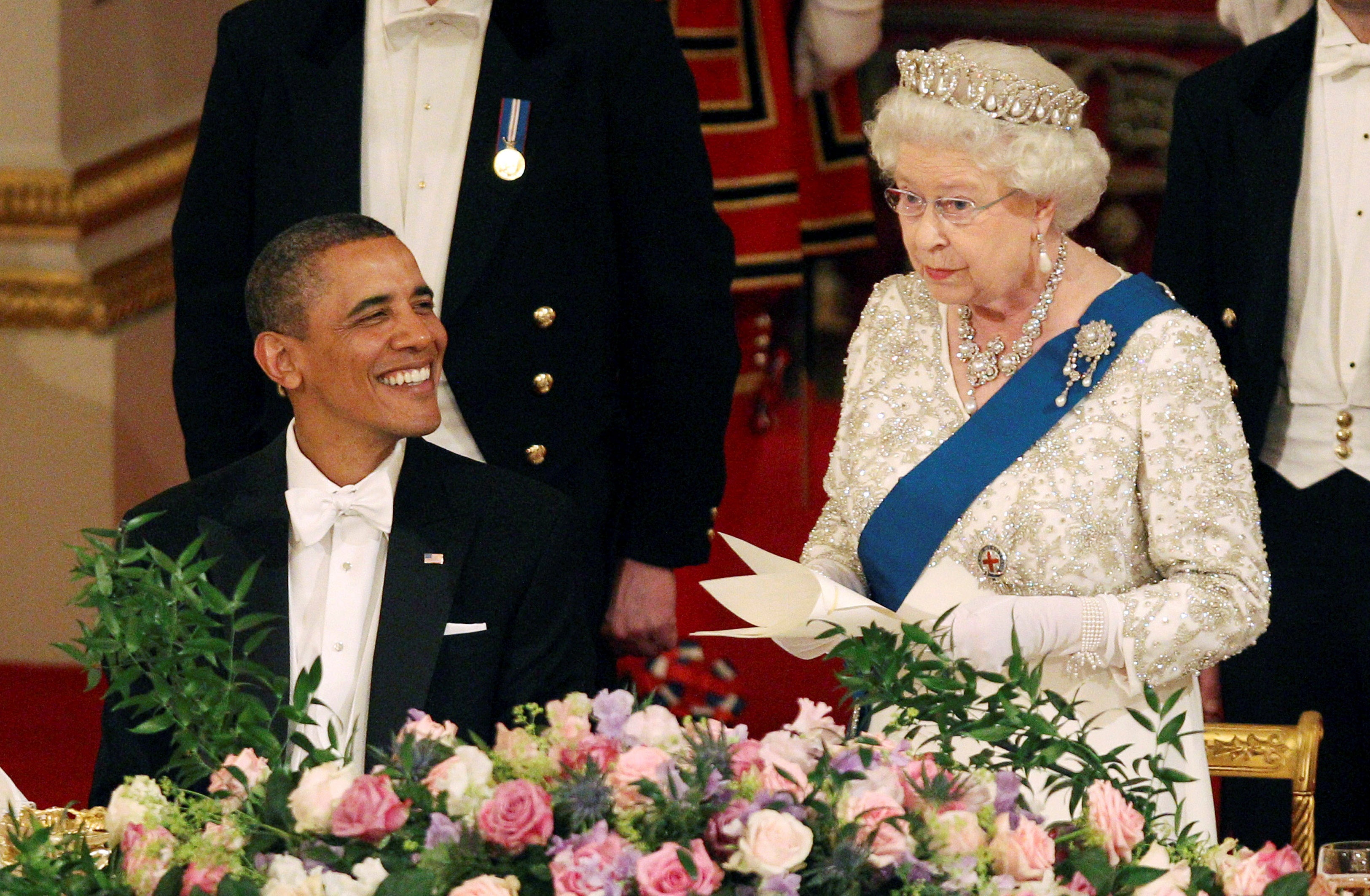 Queen Elizabeth speaks next to President Barack Obama during a State Banquet