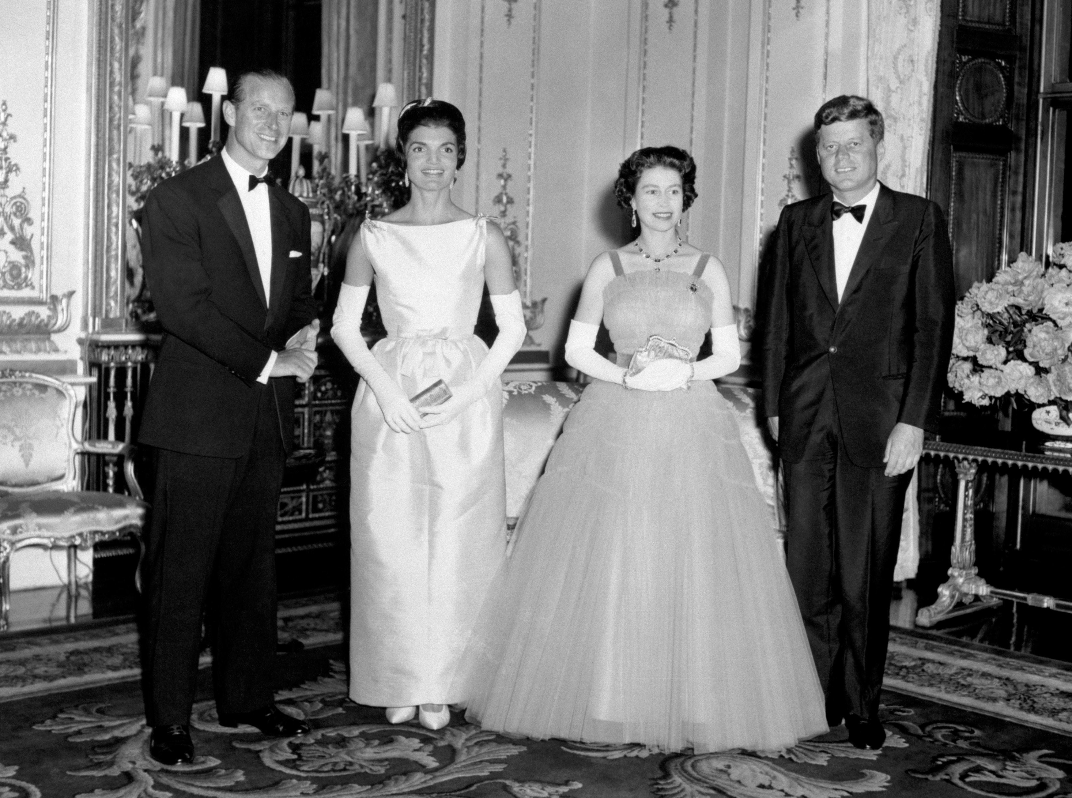 President John Kennedy (right) and his wife Jacqueline (second left) pictured with Queen Elizabeth II (second right) and the Duke of Edinburgh (left) at Buckingham Palace