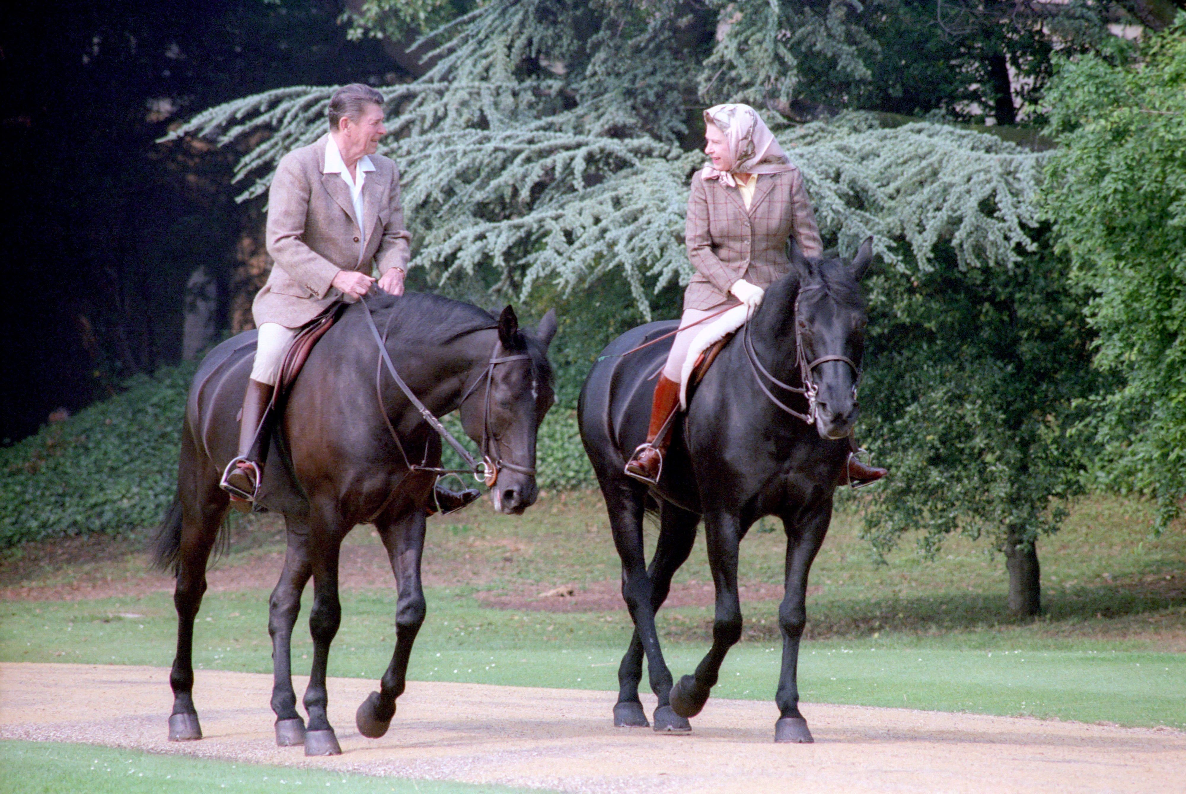 President Ronald Reagan rides horses with Britain's Queen Elizabeth at Windsor Castle