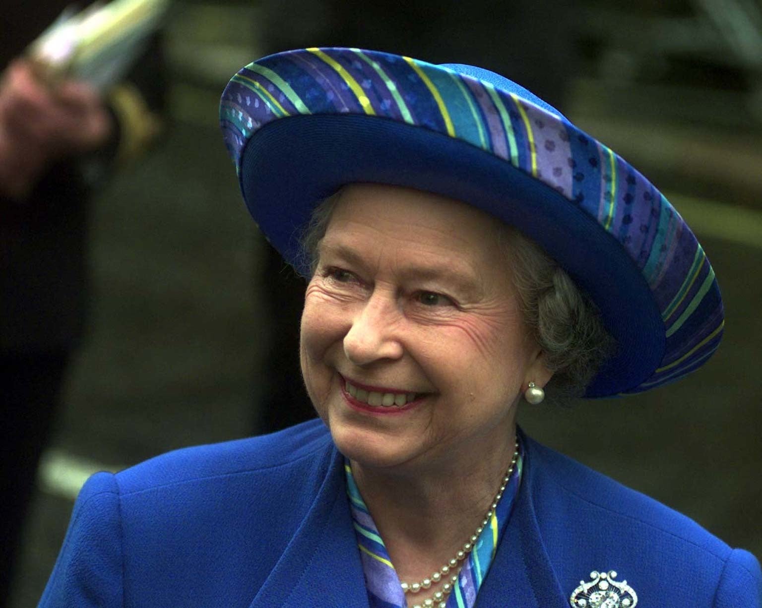 The Queen smiles during a walkabout following a thanksgiving service at Westminster Abbey to celebrate her Golden Wedding Anniversary (Adam Butler/PA)