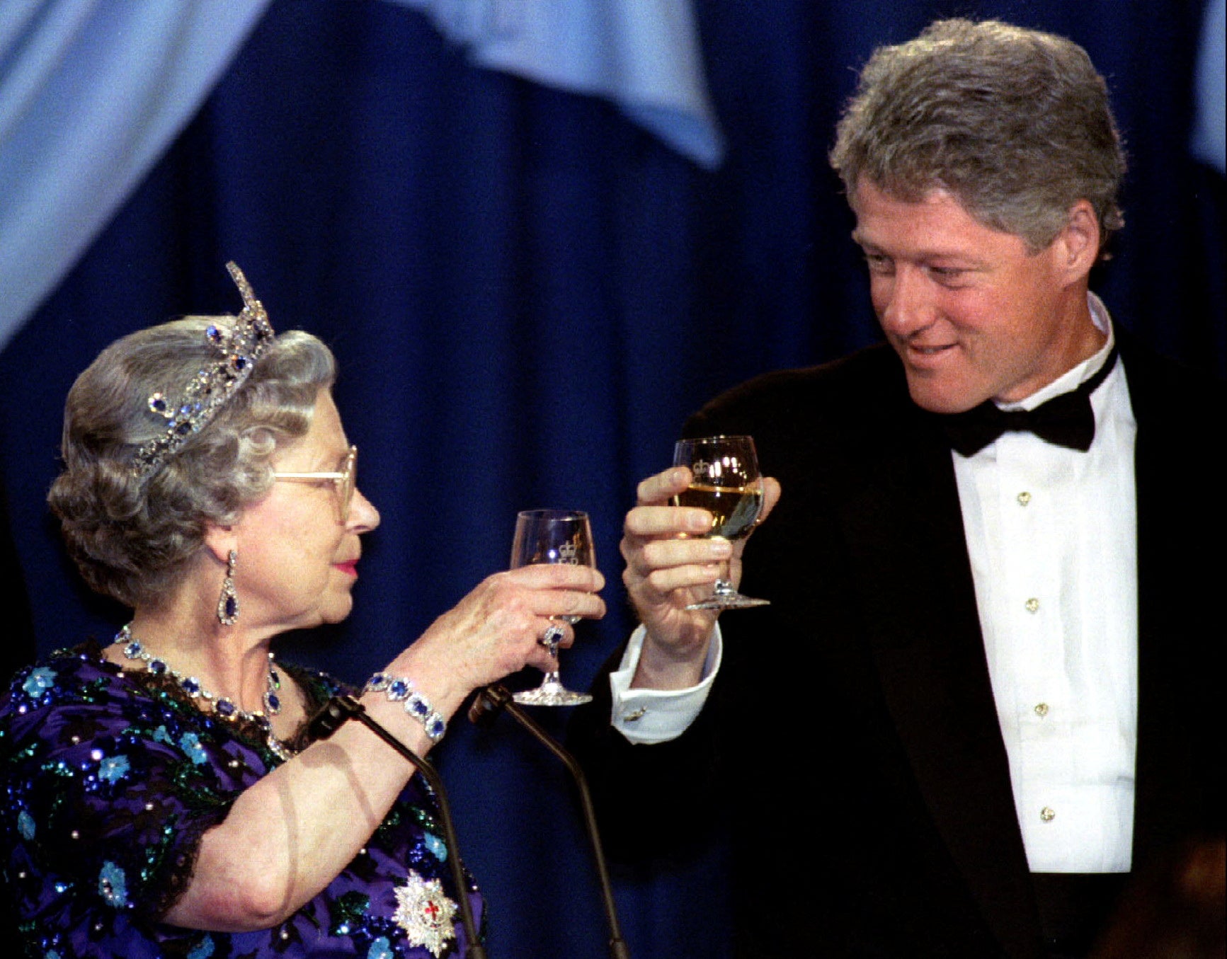 Britain’s Queen Elizabeth and US President Bill Clinton toast following the Queen’s speech at the Guildhall dinner in Portsmouth, 1994