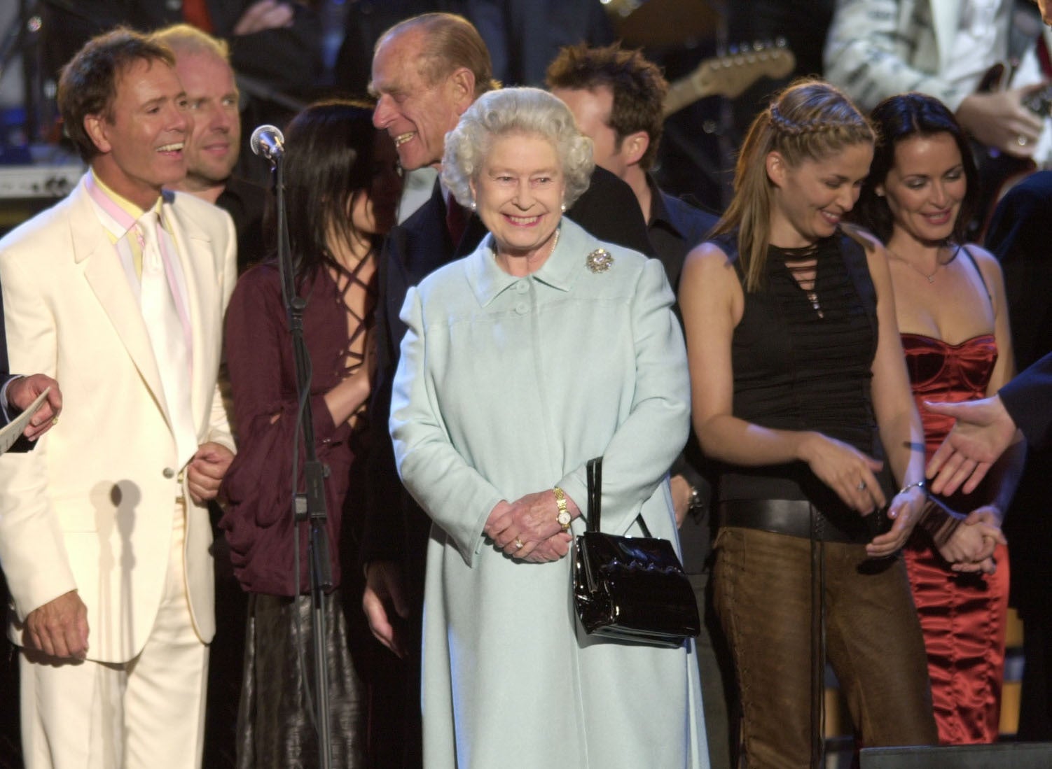 The Queen meets artists on stage in the gardens of Buckingham Palace, after the second concert to commemorate the Golden Jubilee (Stefan Rousseau/PA)