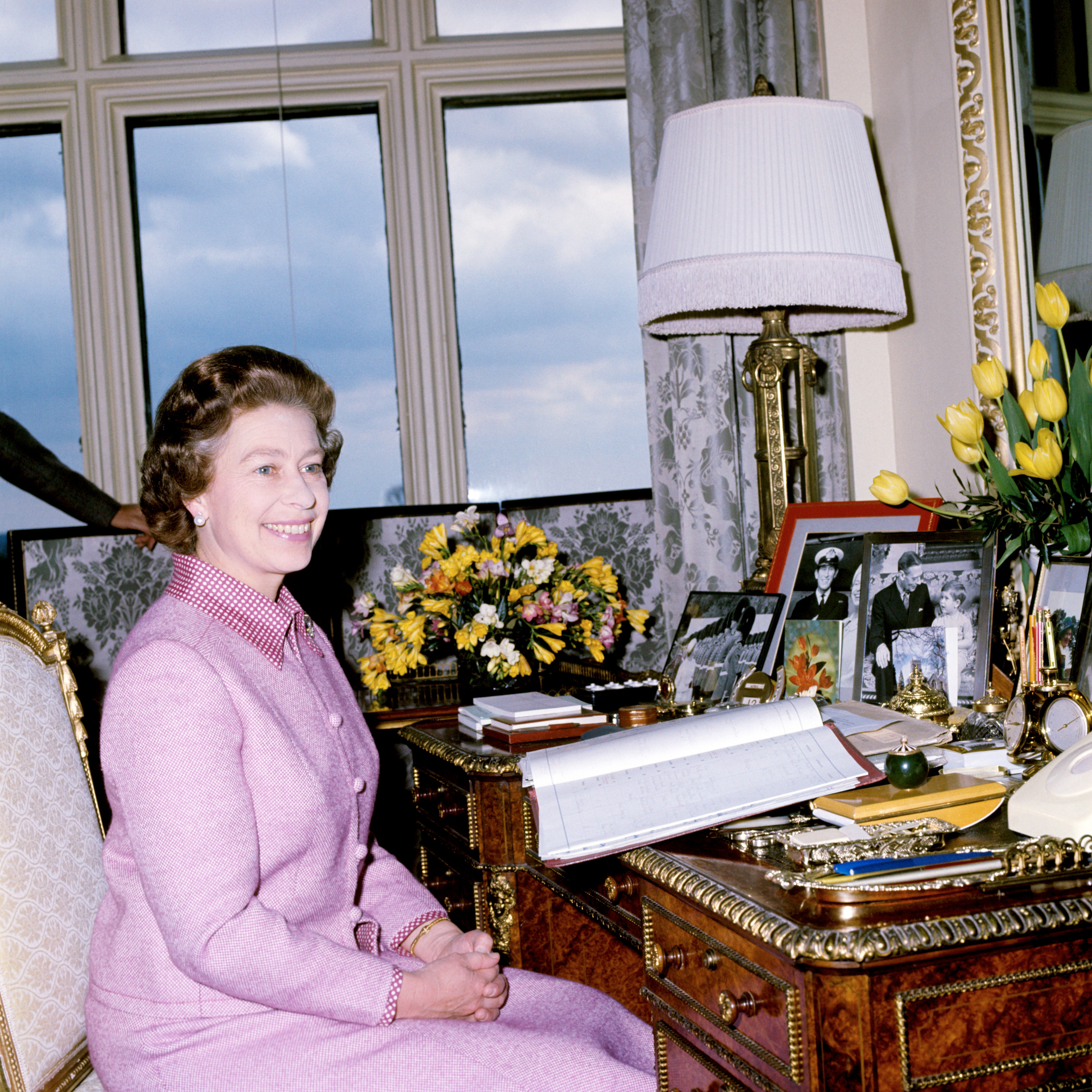 The Queen at her desk at Windsor castle in 1977 (PA)