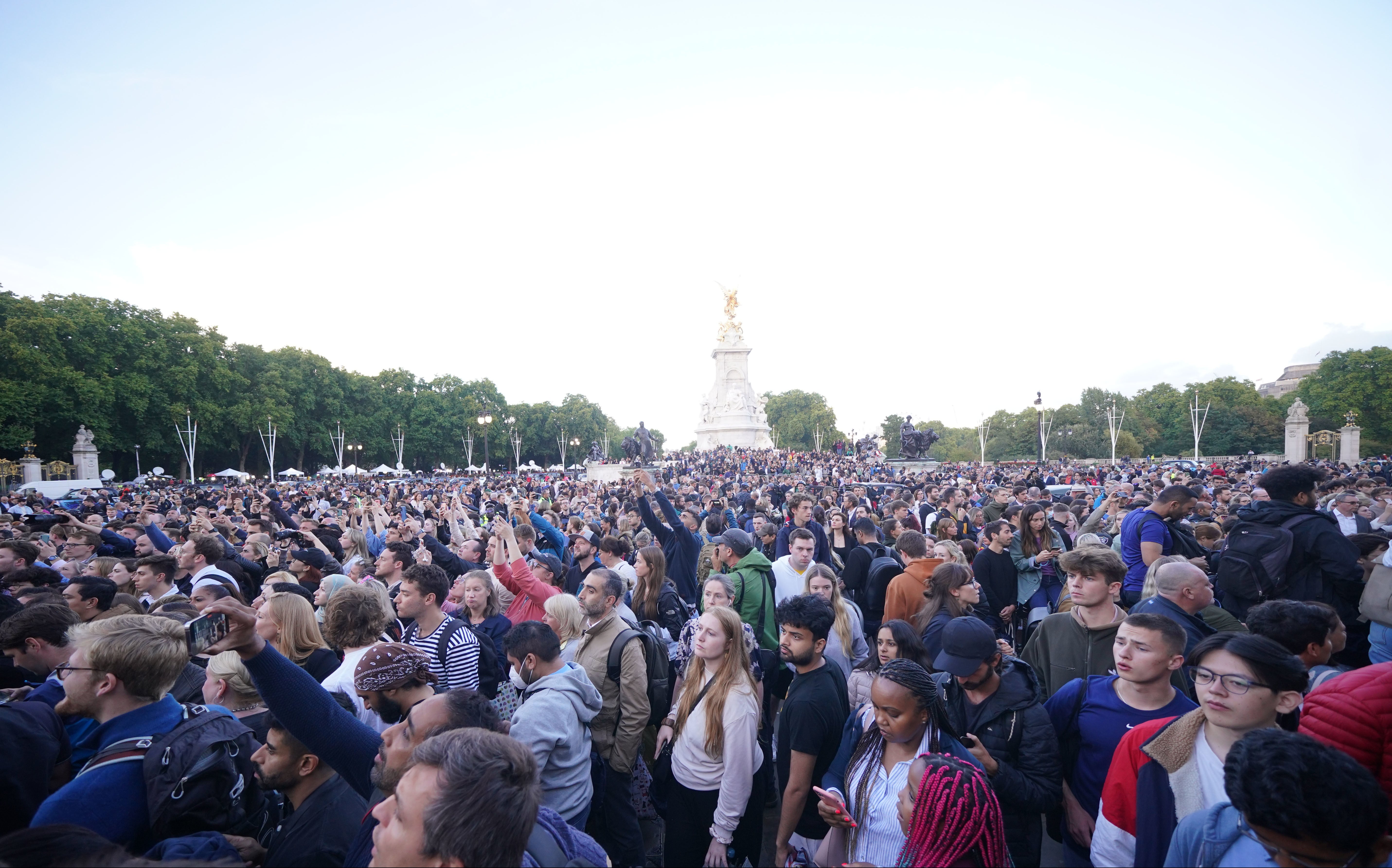 Members of the public gather outside Buckingham Palace in central London (Yui Mok/PA)