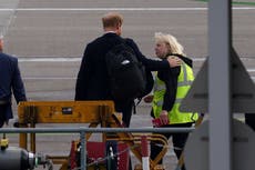 Prince Harry appears to comfort Aberdeen Airport worker as he leaves Balmoral
