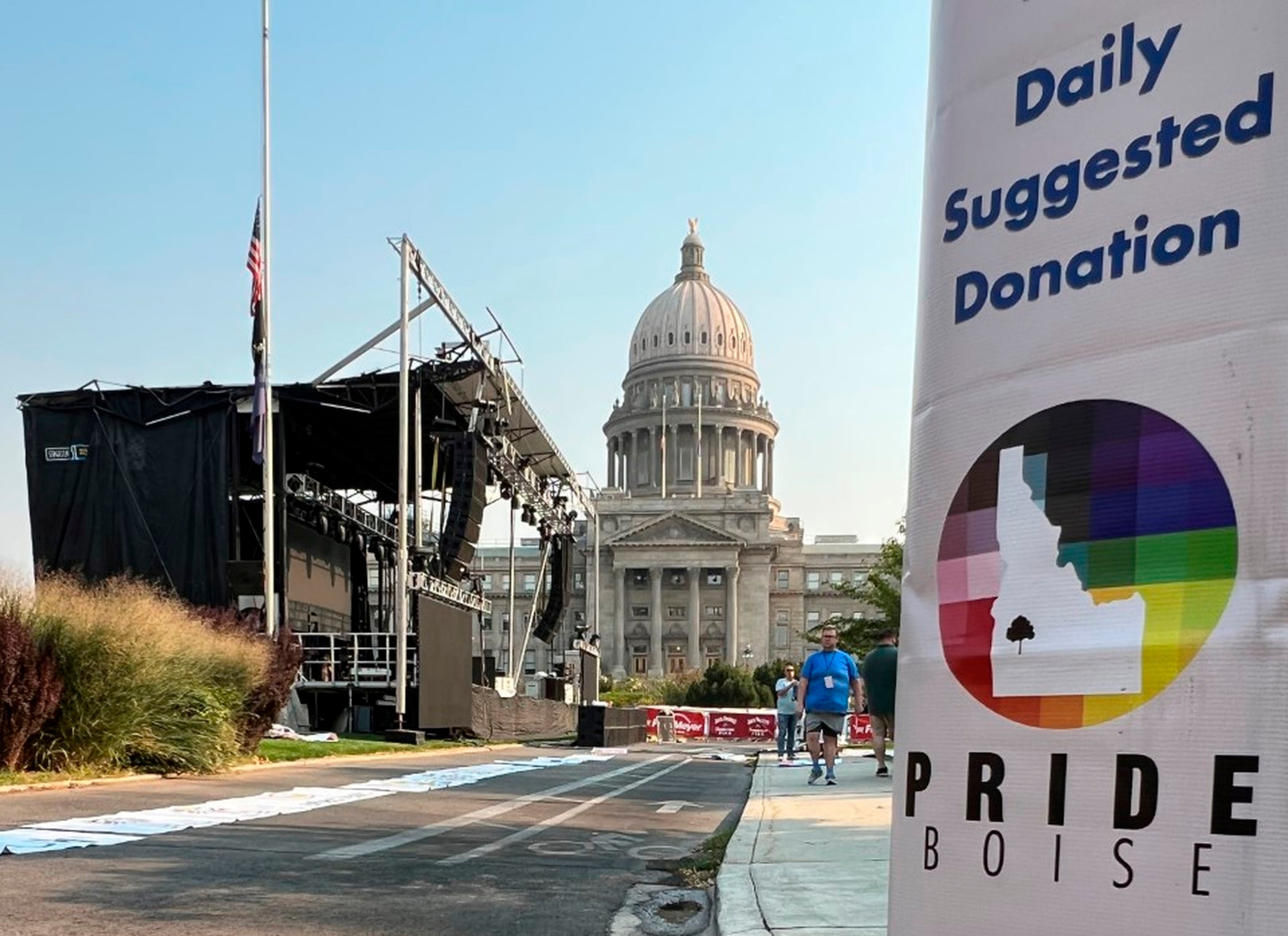 A Boise Pride Festival banner hangs on a lamp post in front of the Idaho Statehouse