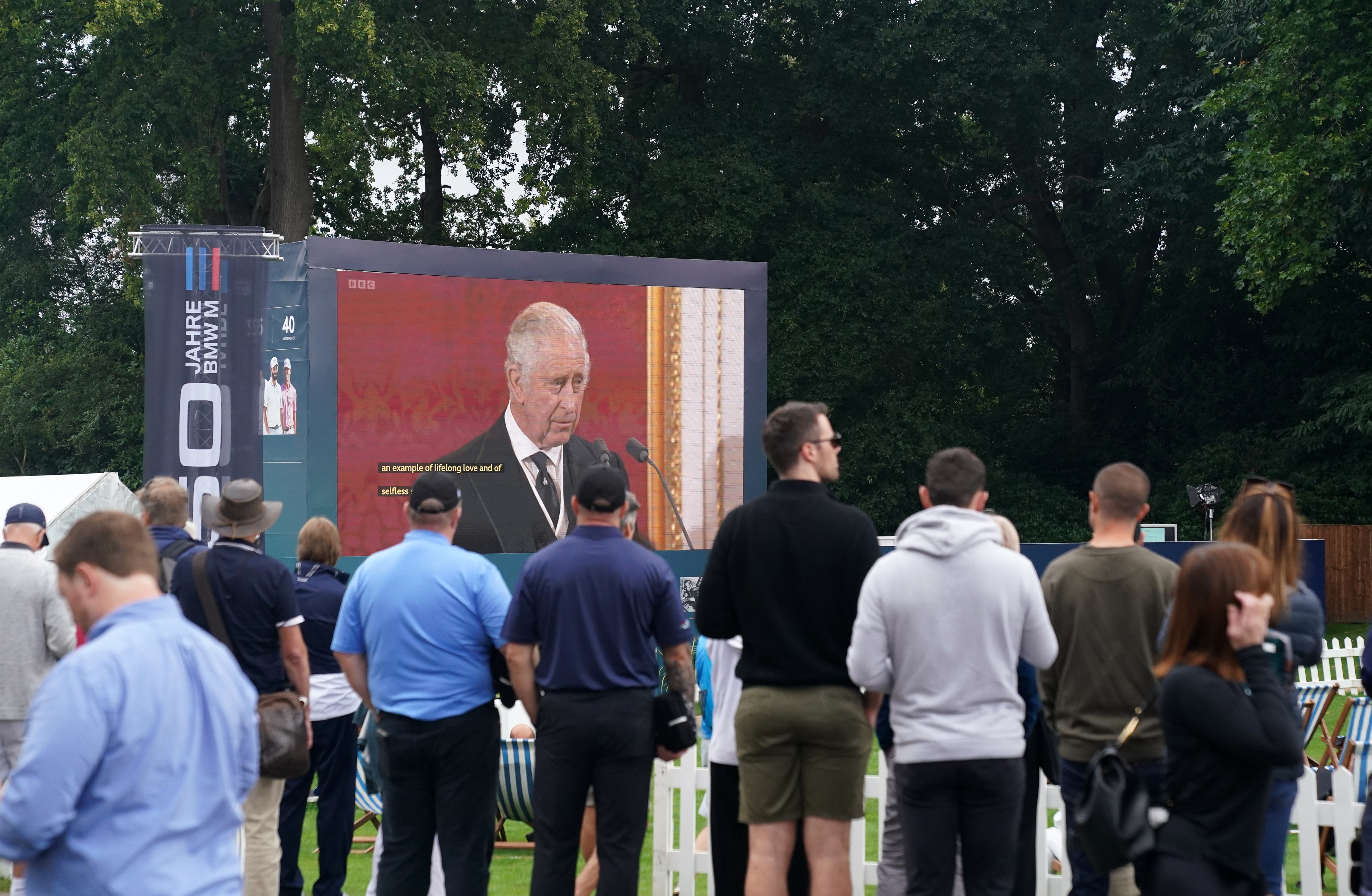 Spectators at Wentworth watch the Accession Council where King Charles III was formally proclaimed monarch on the big screen (Adam Davy/PA)