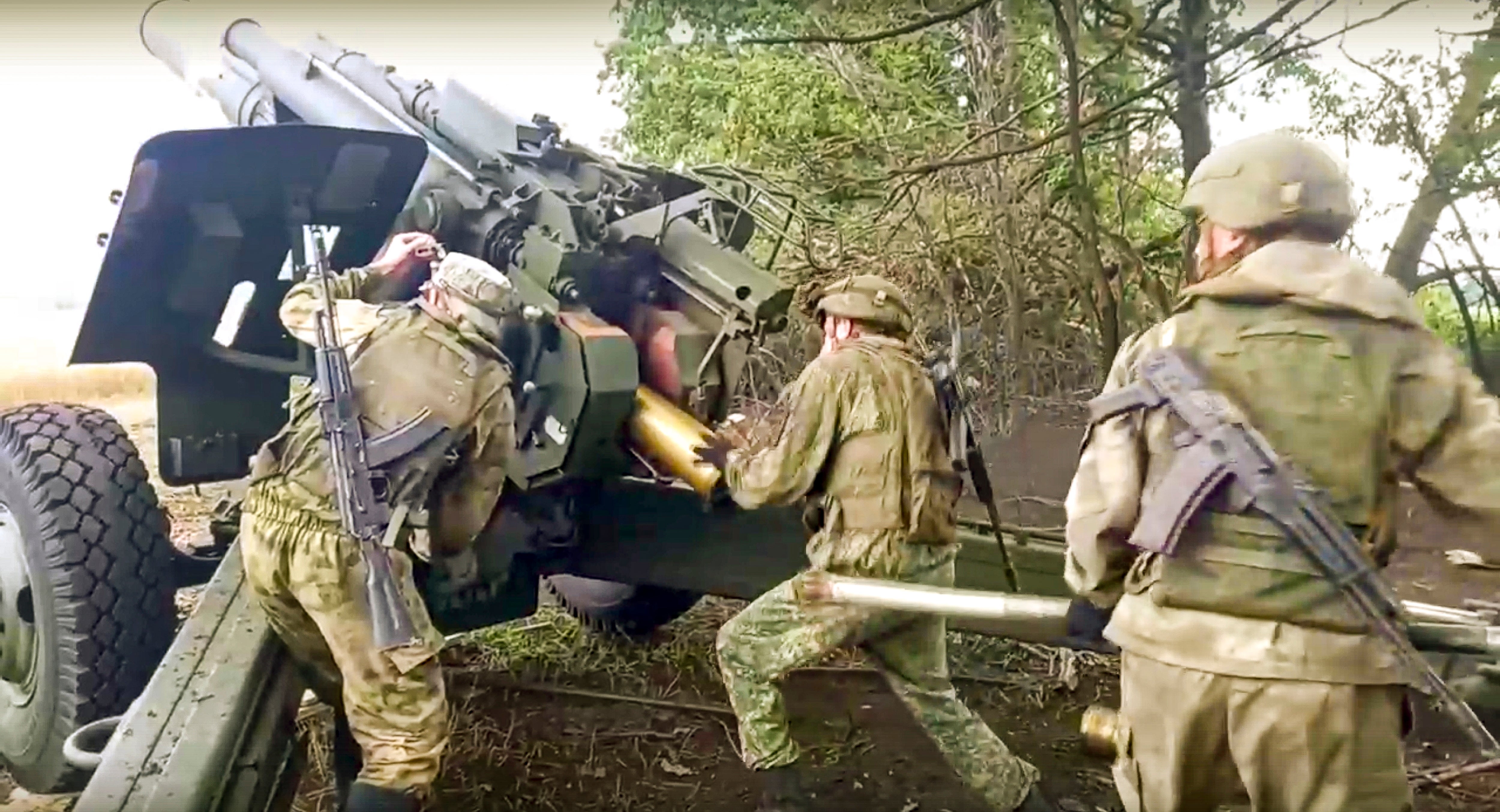 Russian soldiers prepare to fire a Msta-B 152.4mm howitzer from their position at an undisclosed location in Ukraine on Saturday