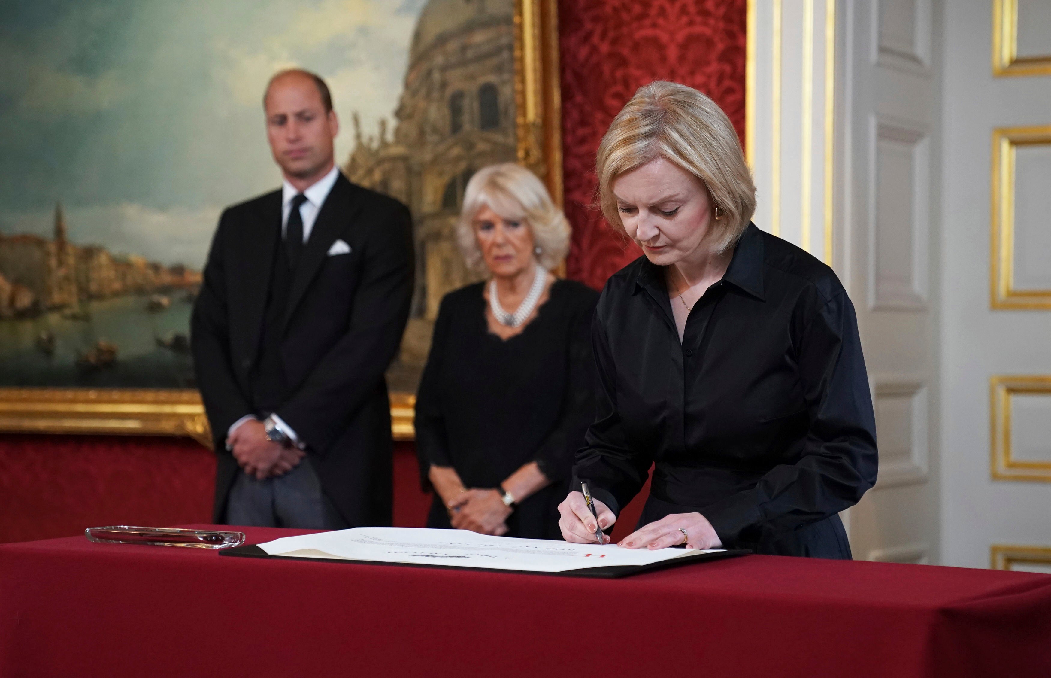 Liz Truss signs the proclamation of accession of King Charles III