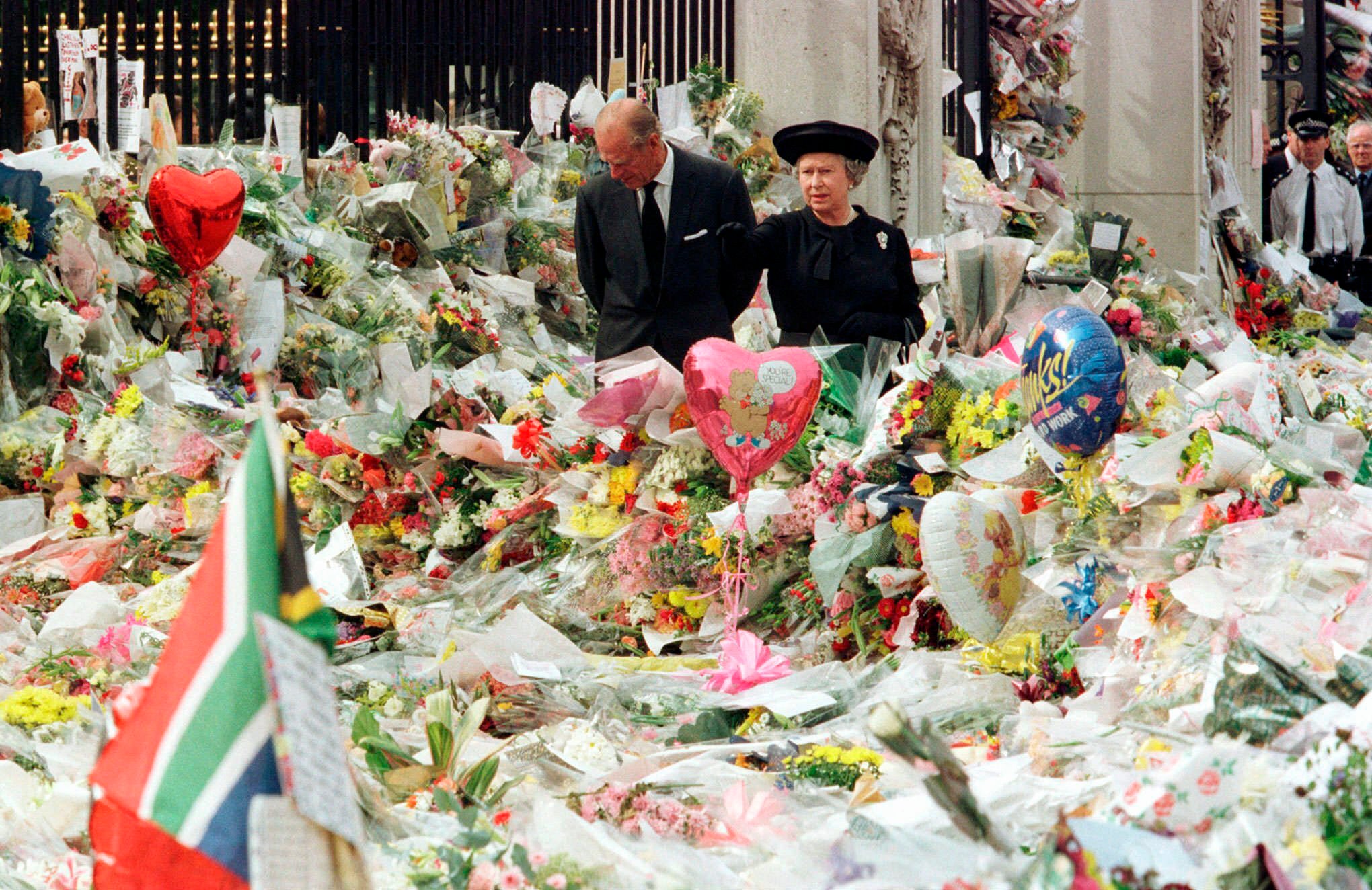 The Queen and Prince Philip viewing the extensive floral tributes to Princess Diana.