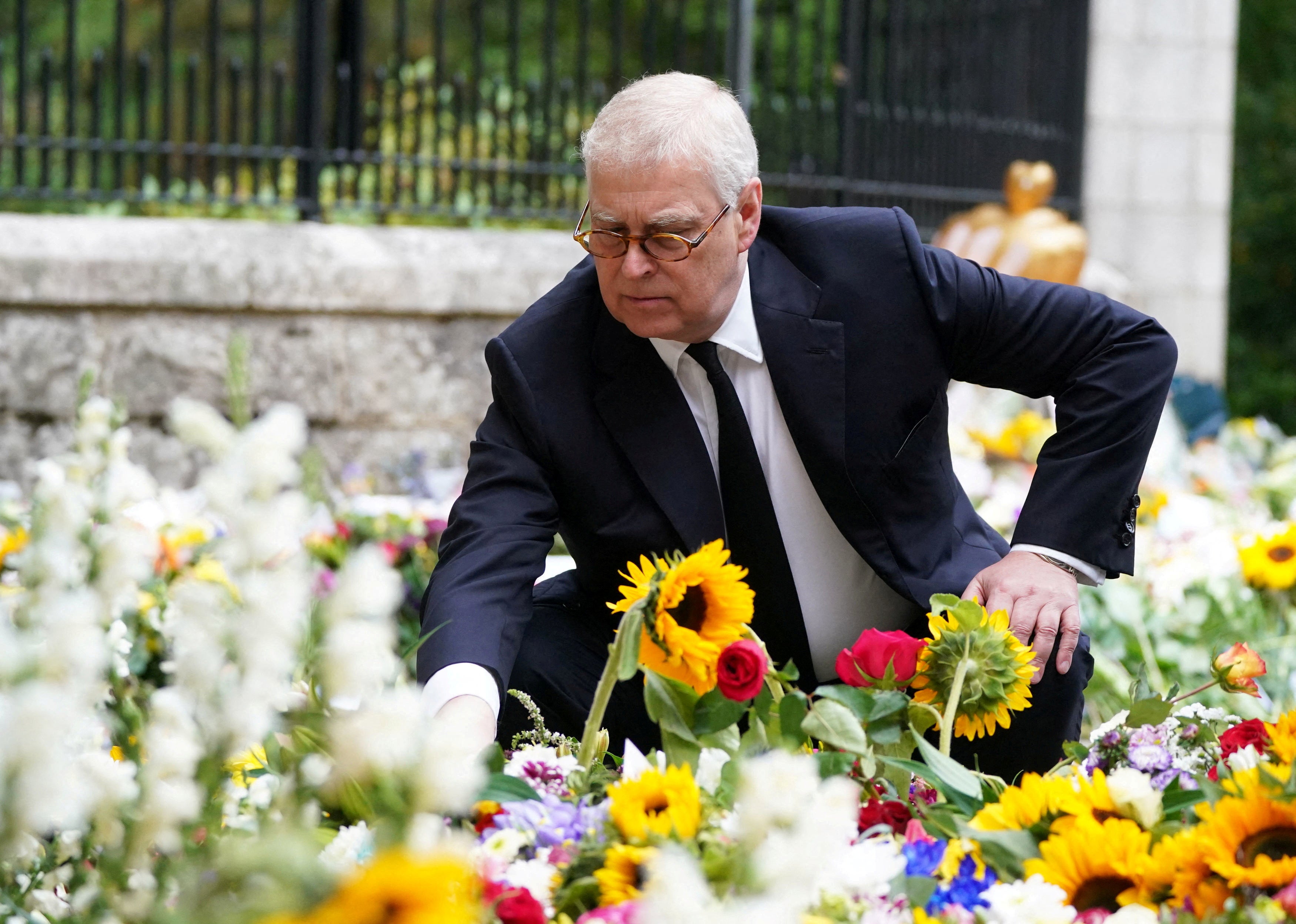 Prince Andrew led senior royals as they examined the tributes left for the Queen at Balmoral