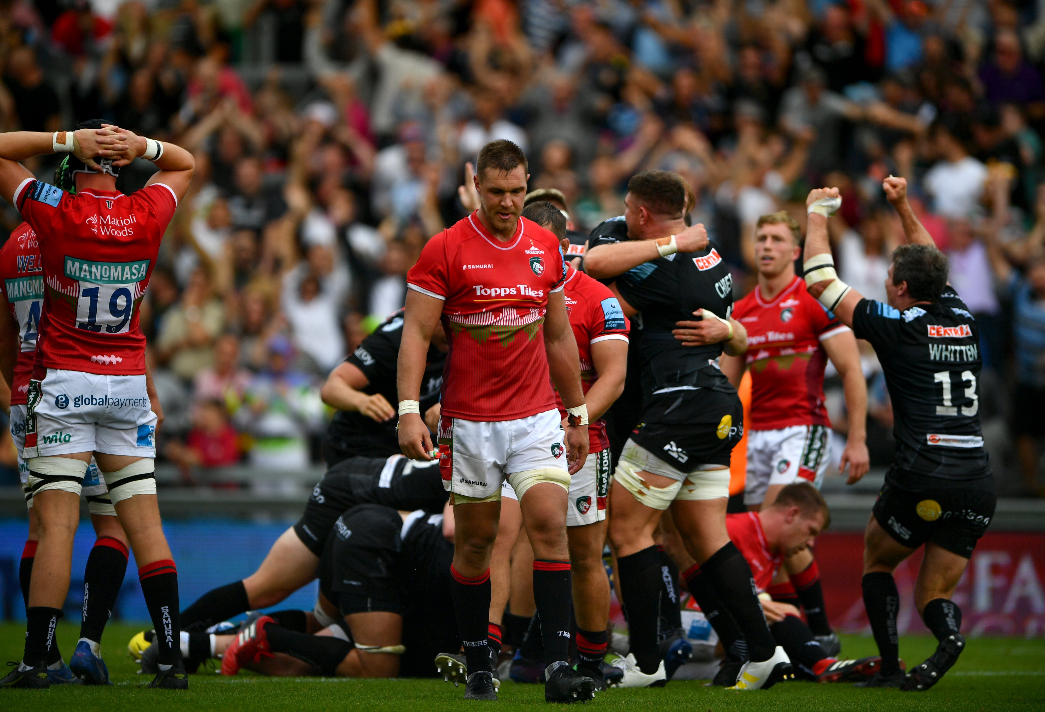 Leicester players are downcast after conceding a late try against Exeter