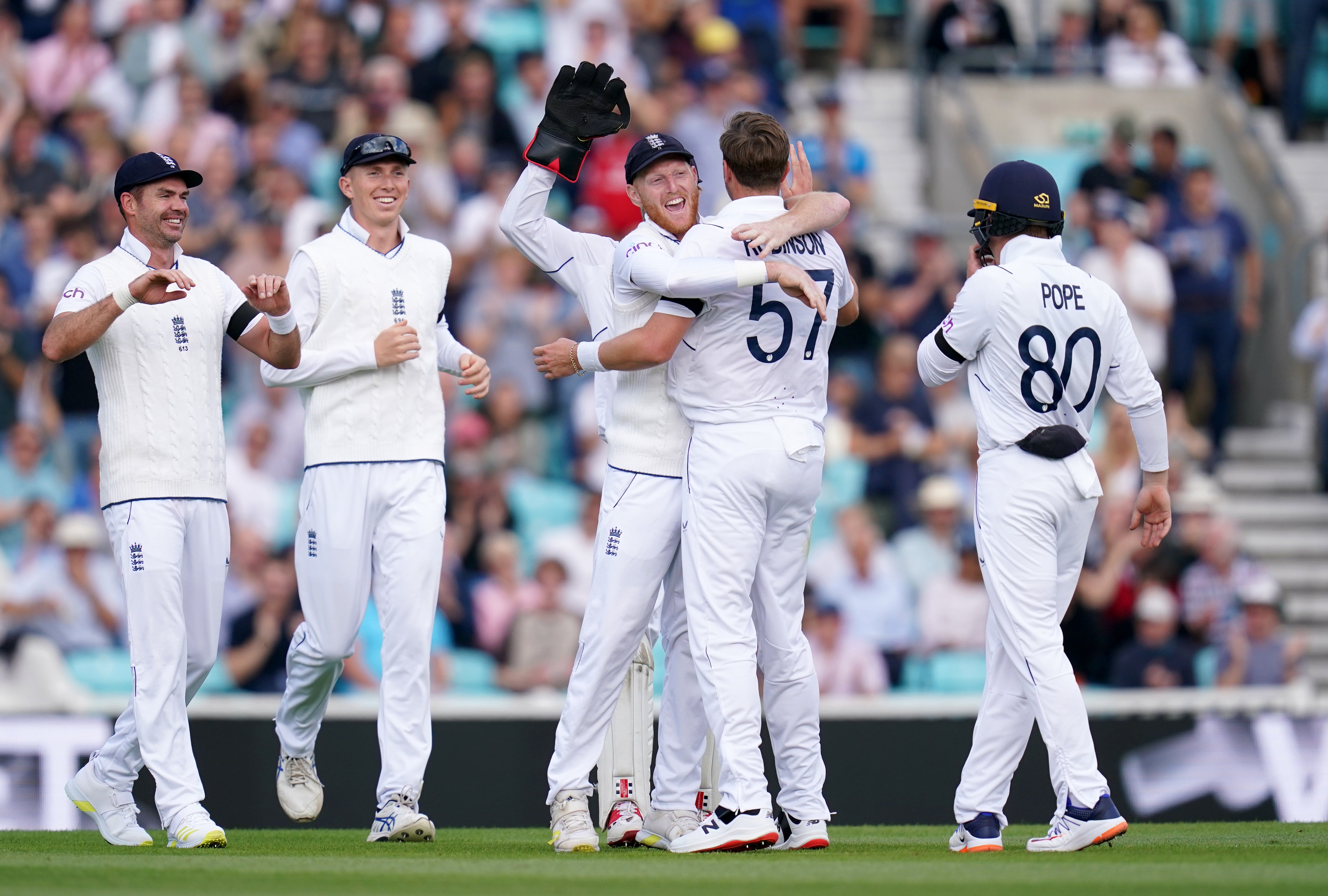 England’s Ollie Robinson is embraced by captain Ben Stokes after taking the wicket of South Africa’s Keegan Petersen on day three of the third LV= Insurance Test match at the Kia Oval, London. Picture date: Saturday September 10, 2022.