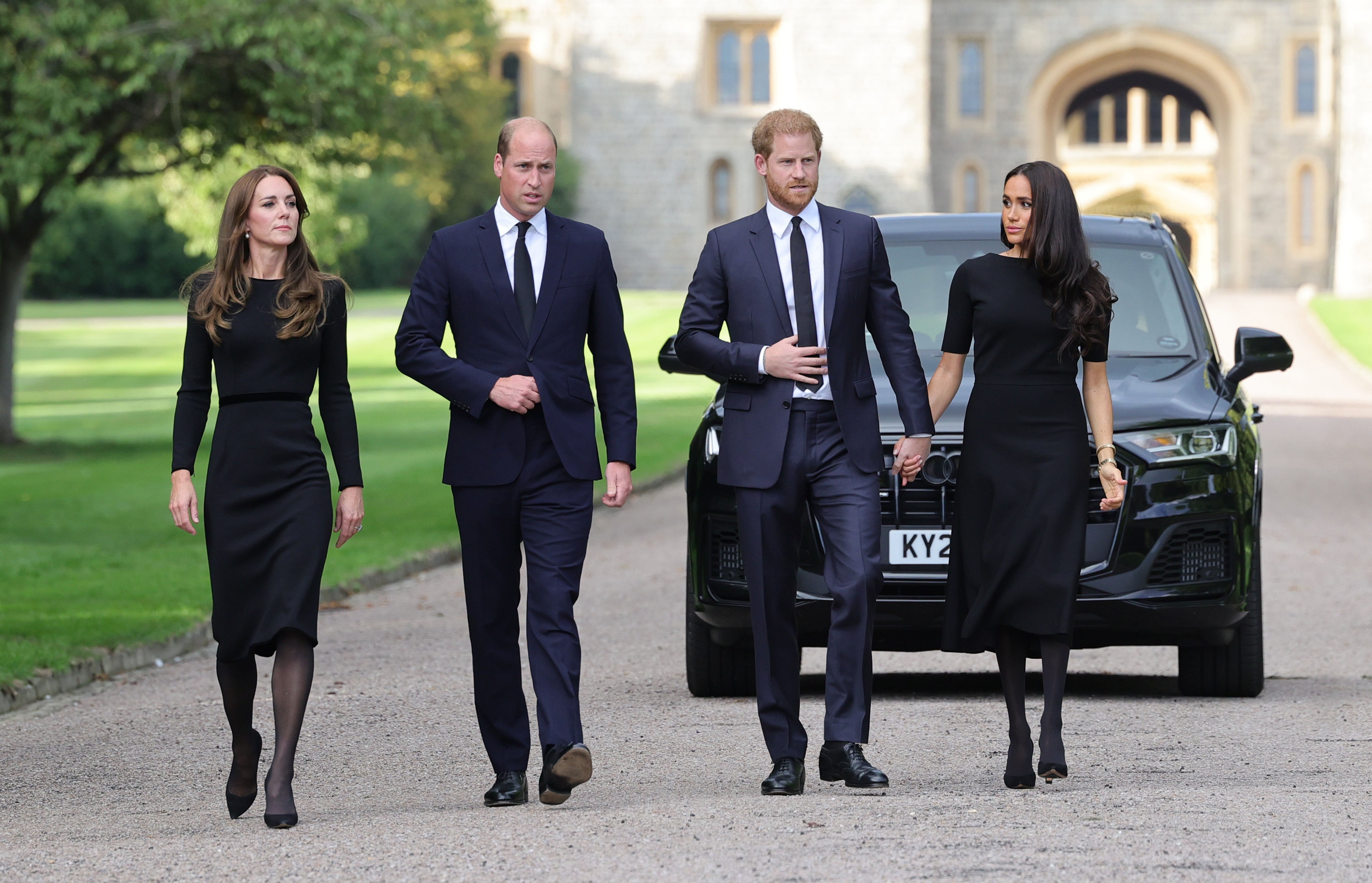 Kate and William reunited with Harry and Meghan to greet people gathered at Windsor on Saturday