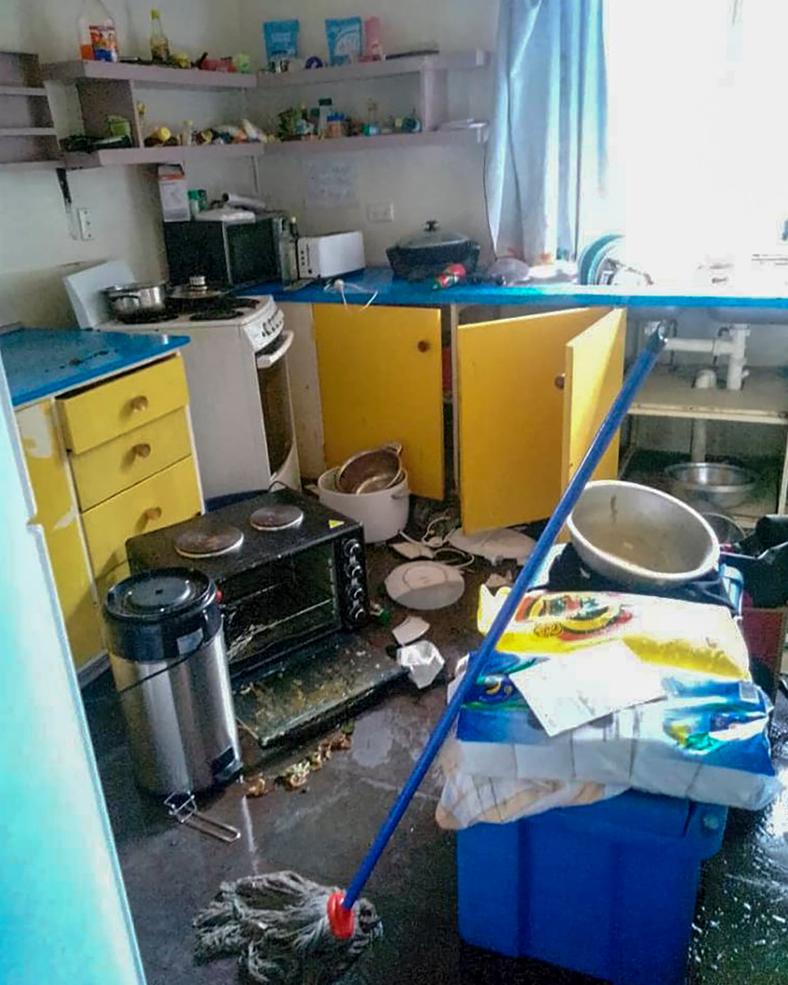 Debris lies strewn across the floor in the kitchen of Renagi Ravu’s house in the town of Kainantu, following a strong earthquake in northeastern Papua New Guinea on 11 September 2022