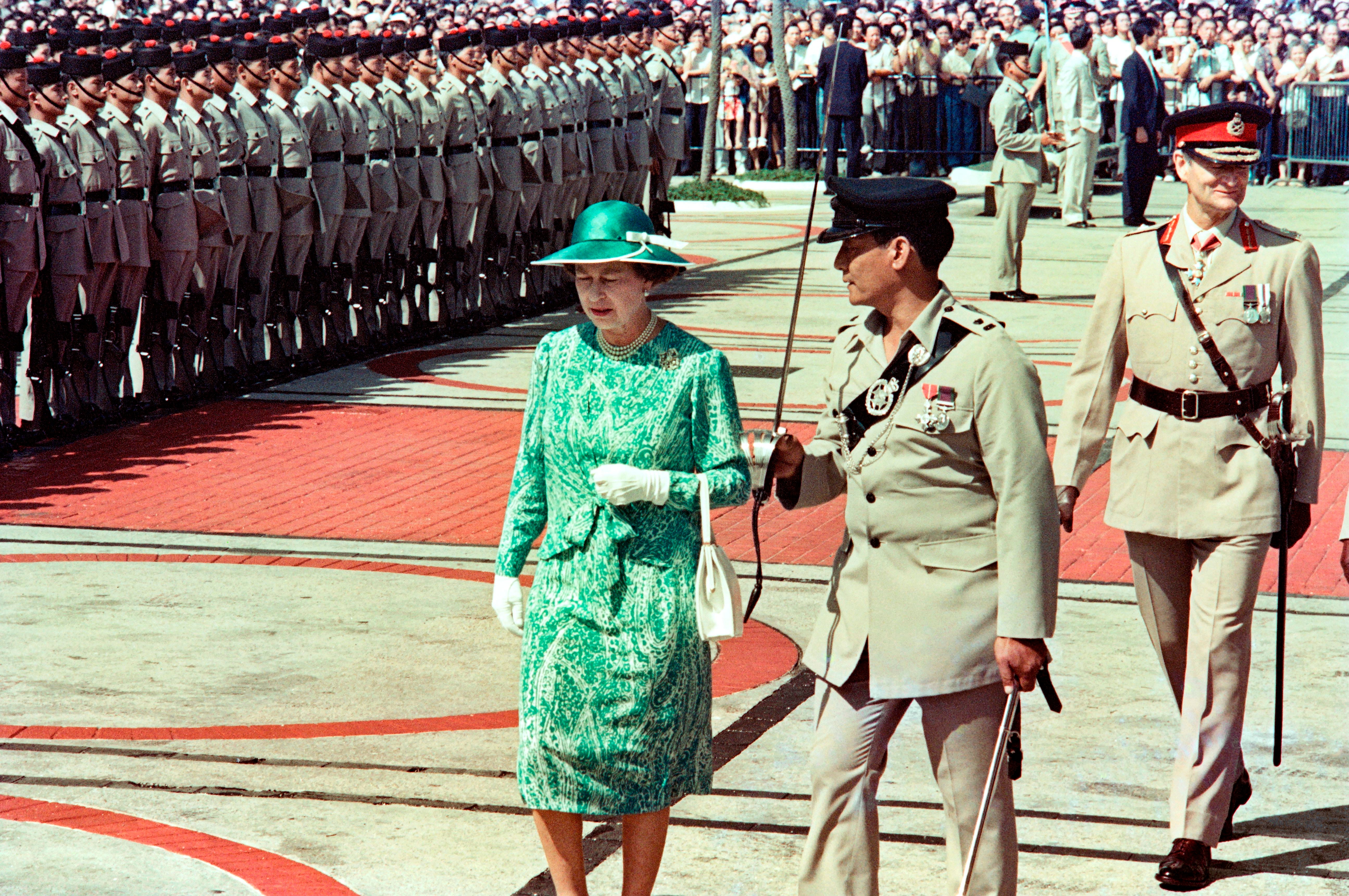 The Queen inspects the guard of honour in Hong Kong on 21 October, 1986