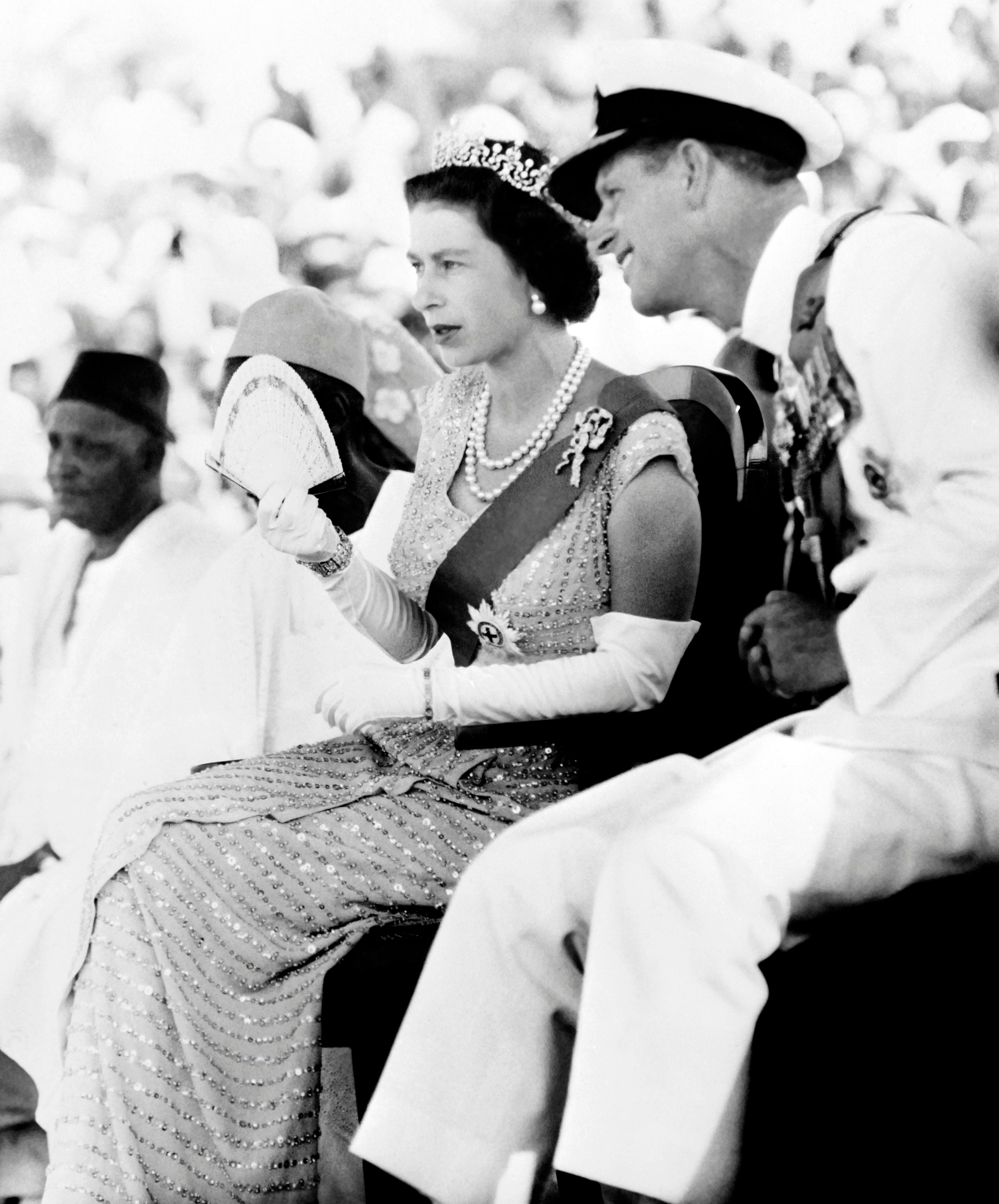 The Queen and Prince Philip watch the Susu dancers in northern Sierra Leone on 4 December 1961,months after the former British colony declared independence