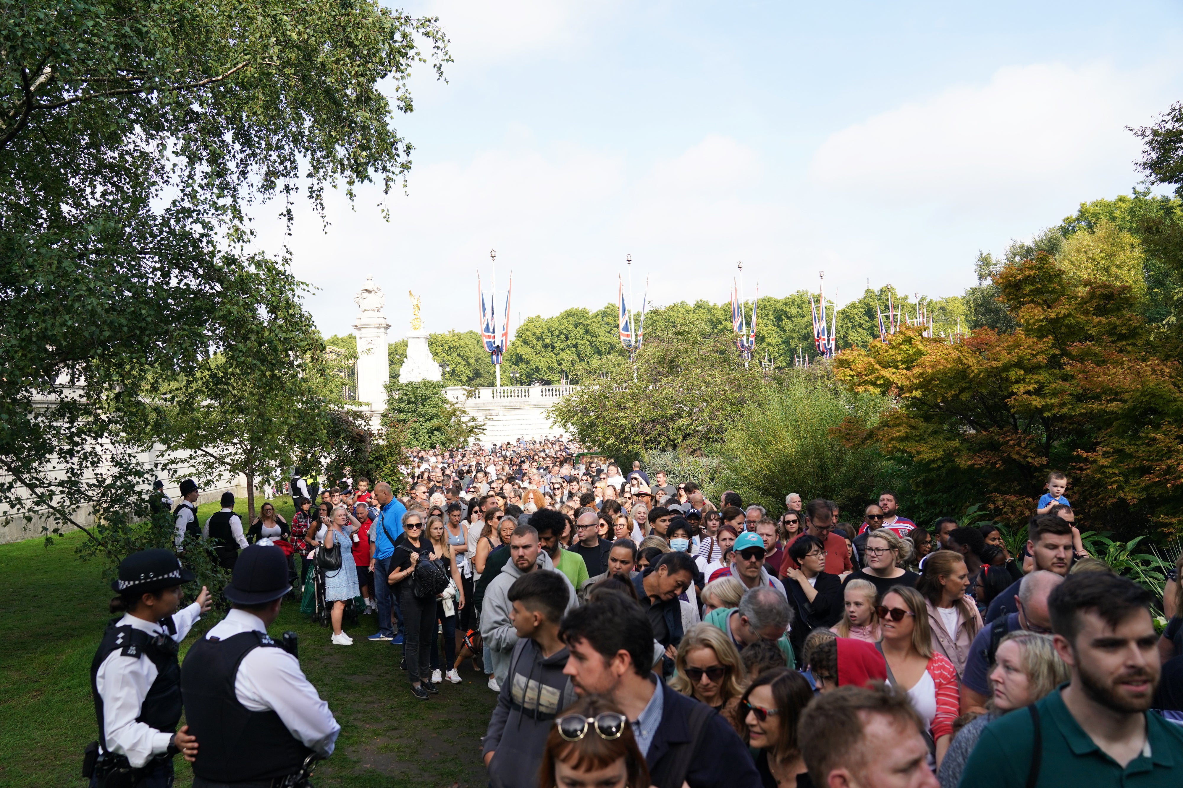 Well-wishers queue to view floral tributes outside Buckingham Palace, London (Joe Giddens/PA)