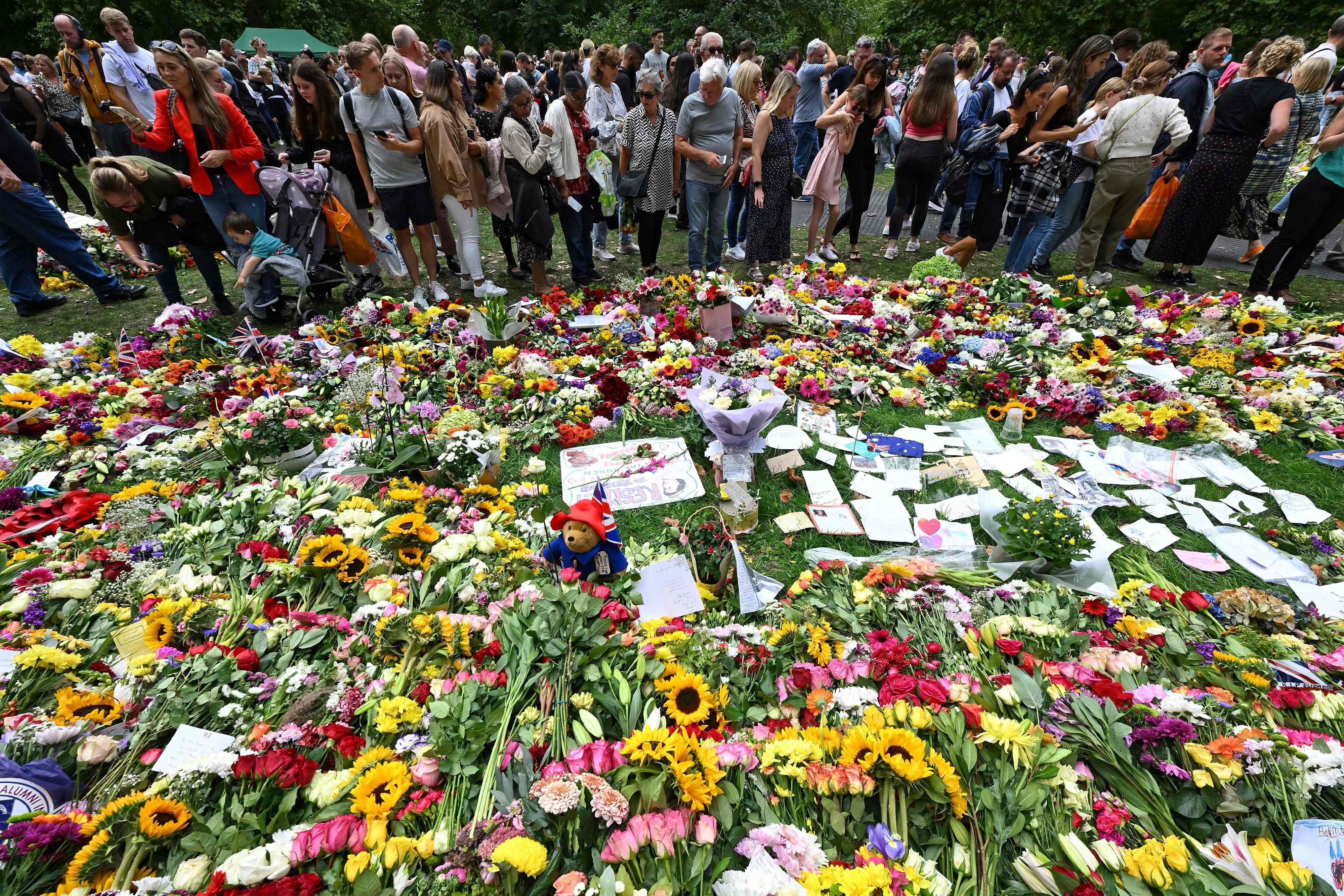 Floral tributes have been piling up in Green Park near Buckingham Palace