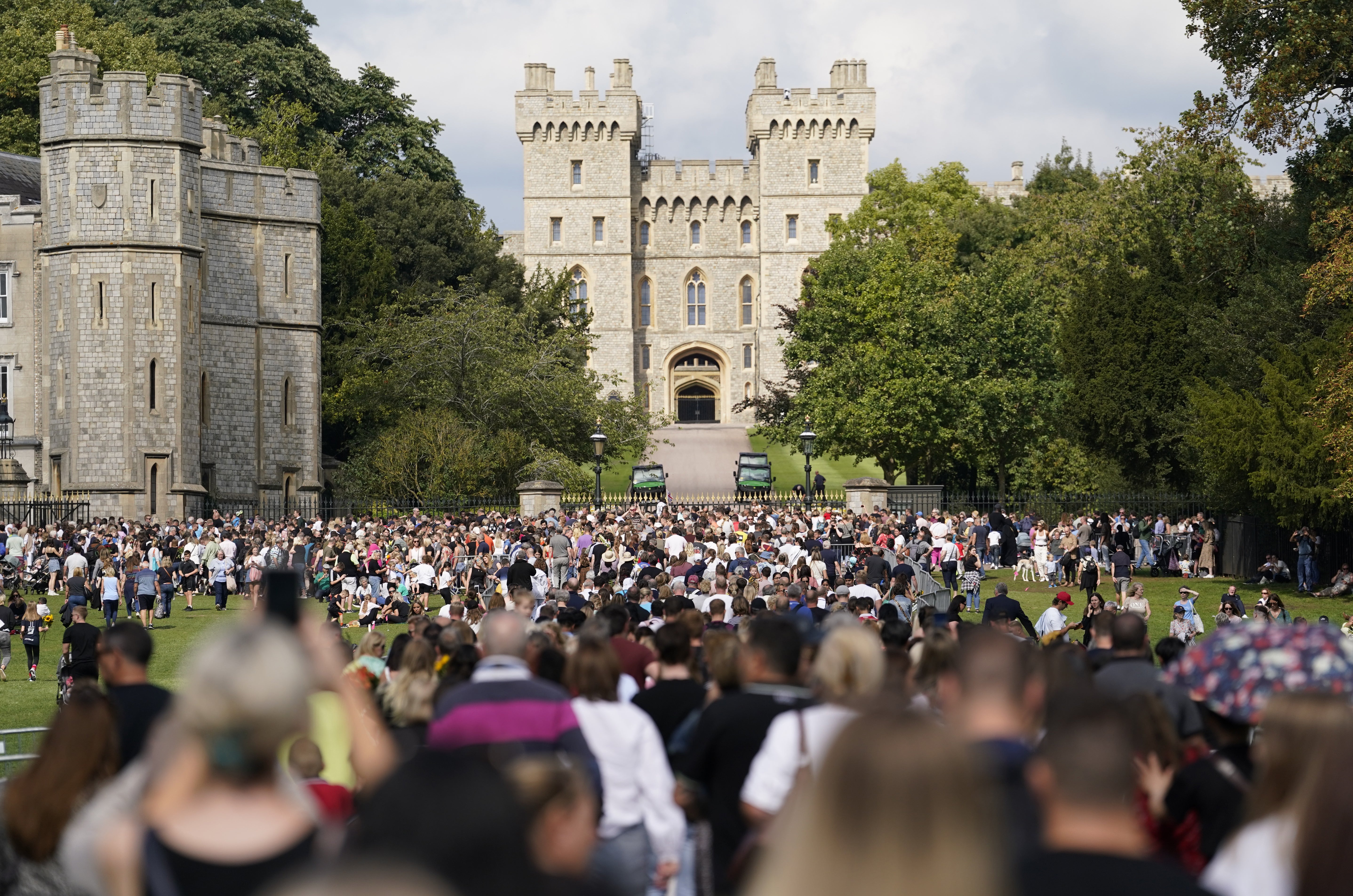 People make their way along the Long Walk towards Cambridge gate outside Windsor Castle, to lay flowers