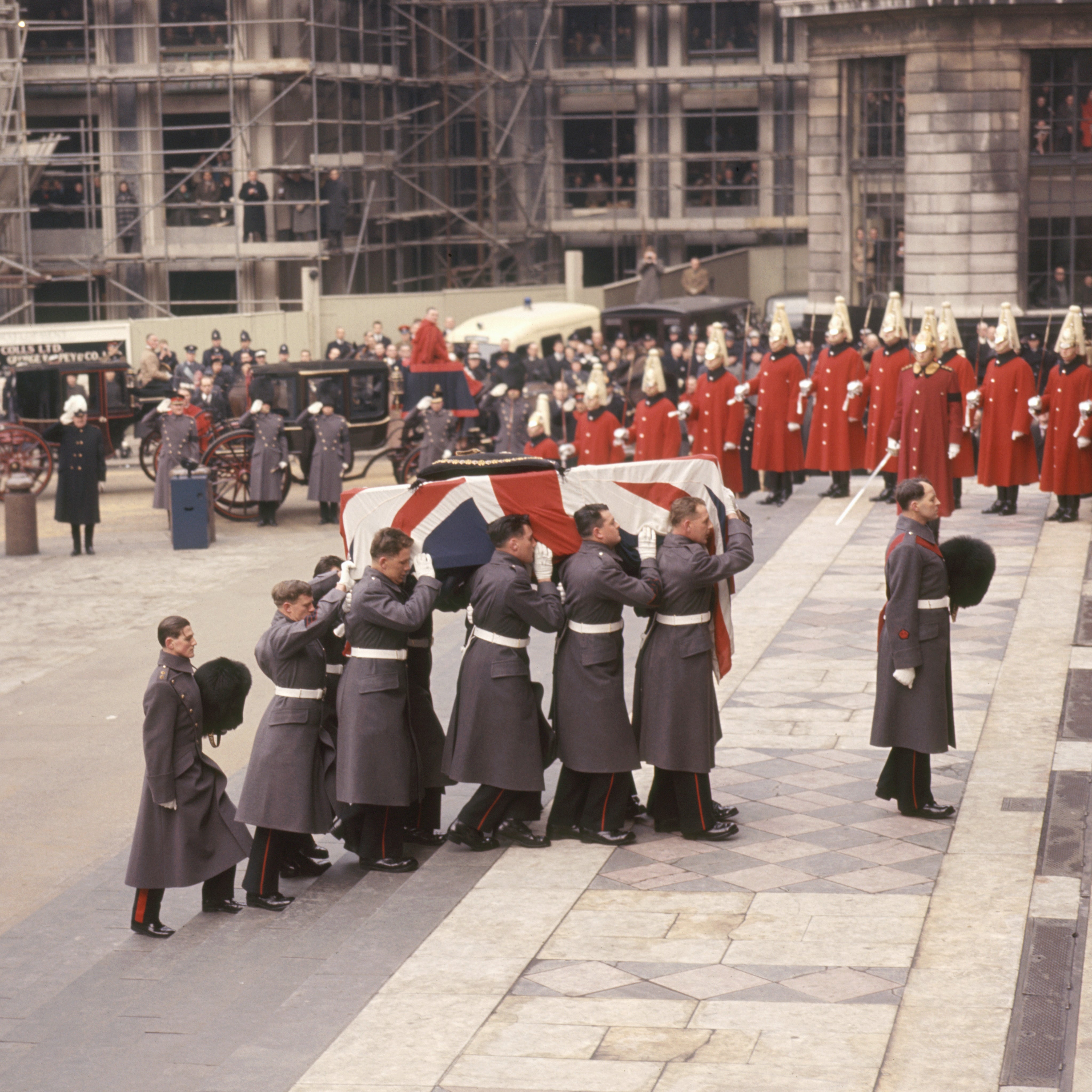 Sir Winston Churchill's flag-draped coffin is carried by Grenadier Guards into St. Paul's Cathedral for the funeral service.