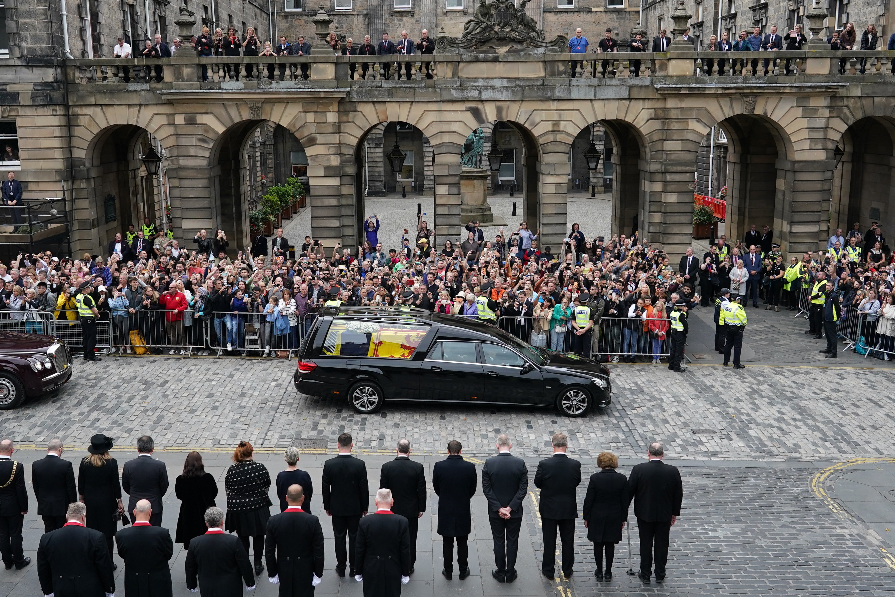 Crowds watched the cortege as it arrived after a six hour journey