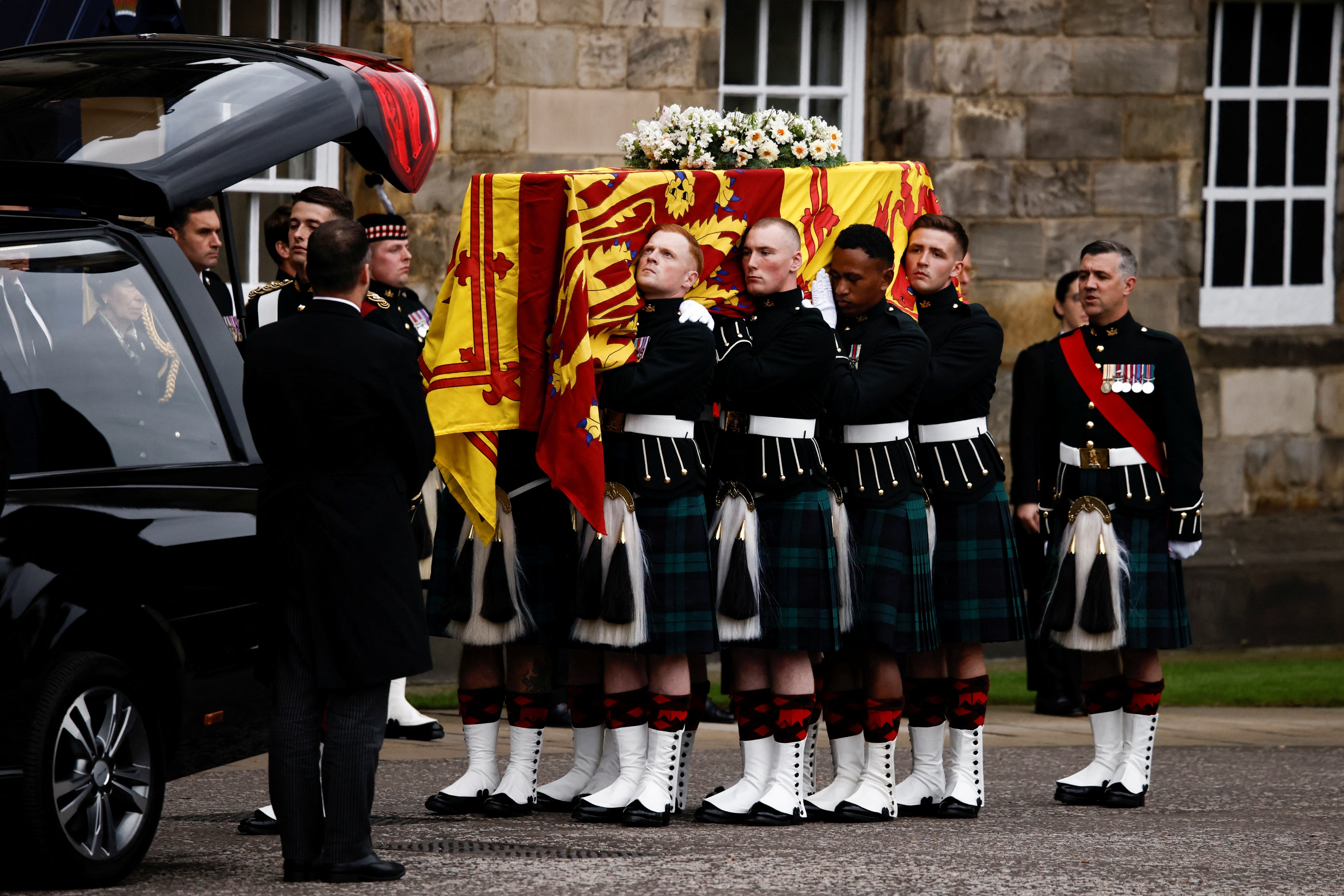 The coffin was removed from the hearse at Holyroodhouse