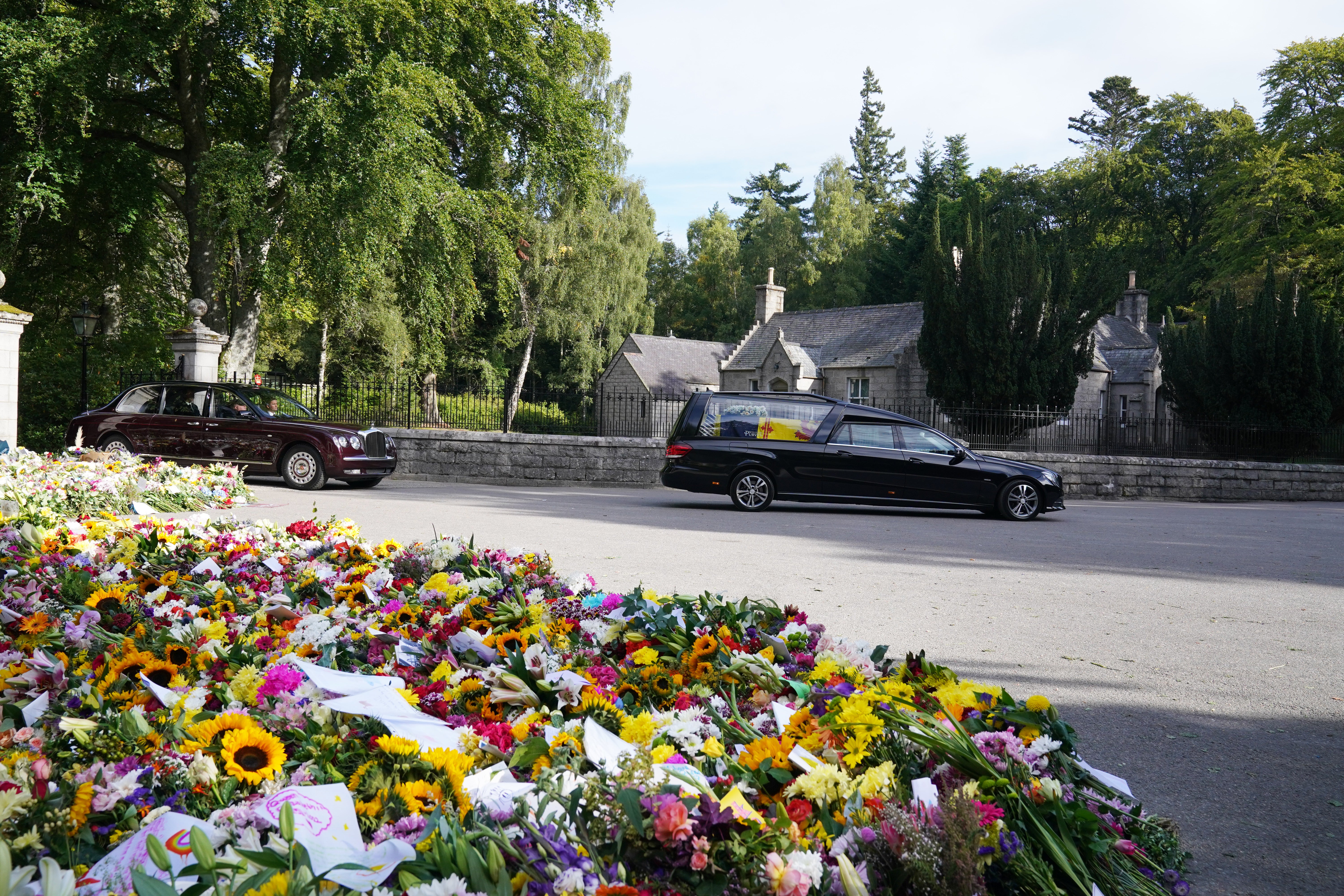 The hearse carrying the coffin of the Queen leaves Balmoral (Owen Humphreys/PA)