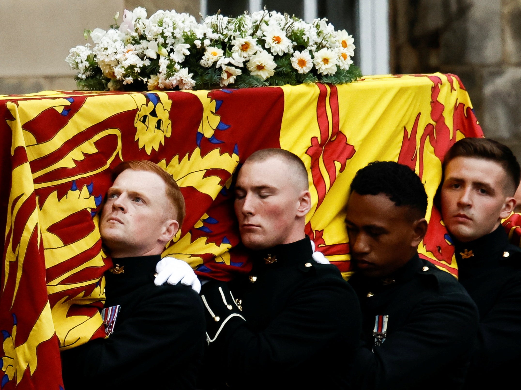 Pallbearers carried the coffin