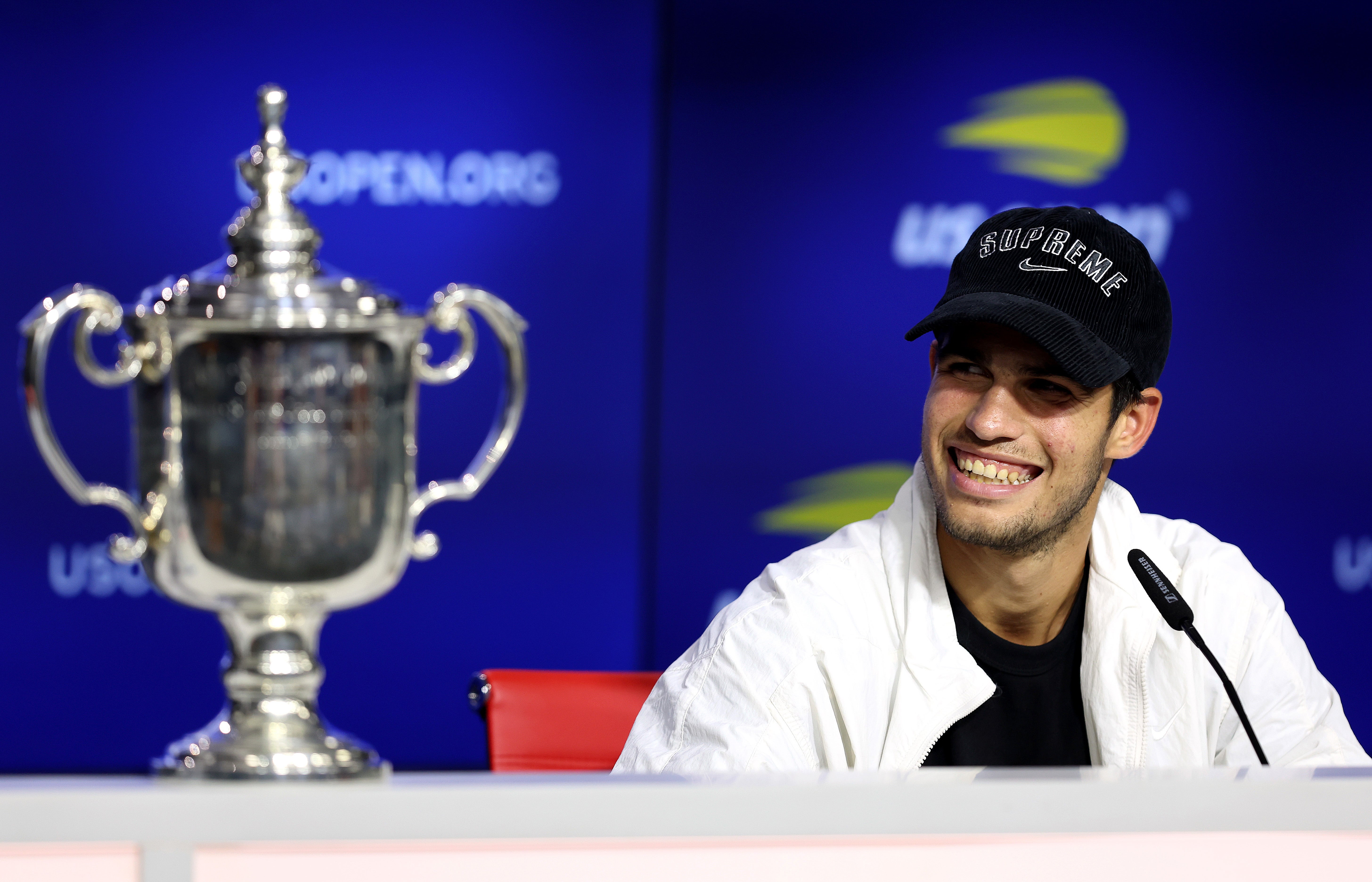 Carlos Alcaraz beams after securing his first major trophy