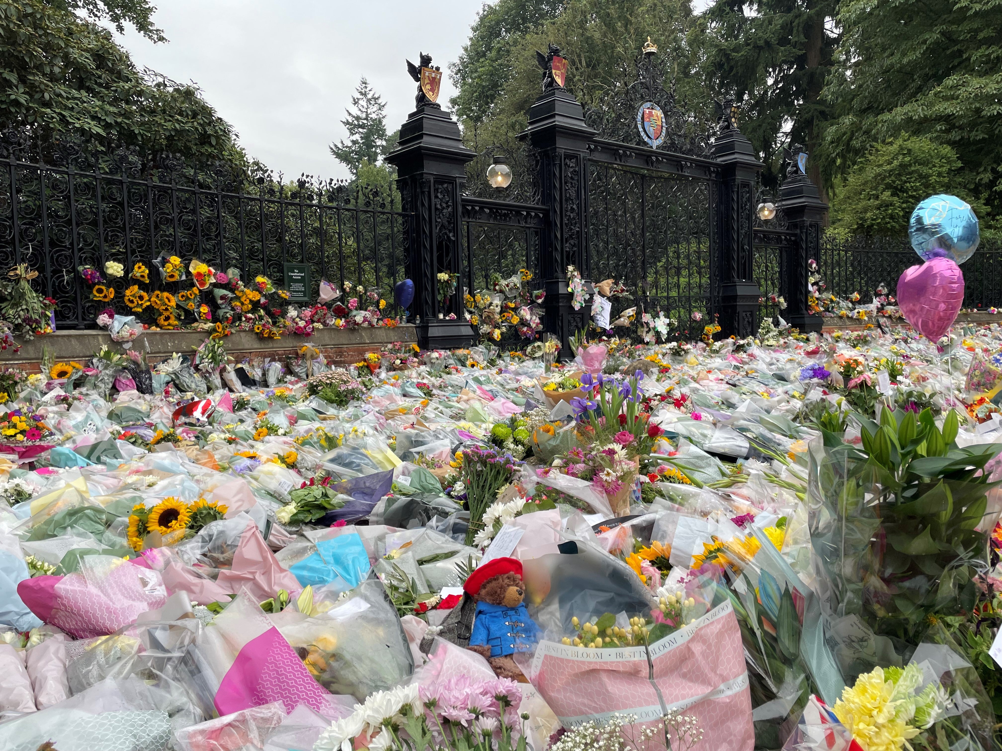 Floral tributes to the Queen were left at the Norwich Gates by Sandringham House (Sam Russell/ PA)