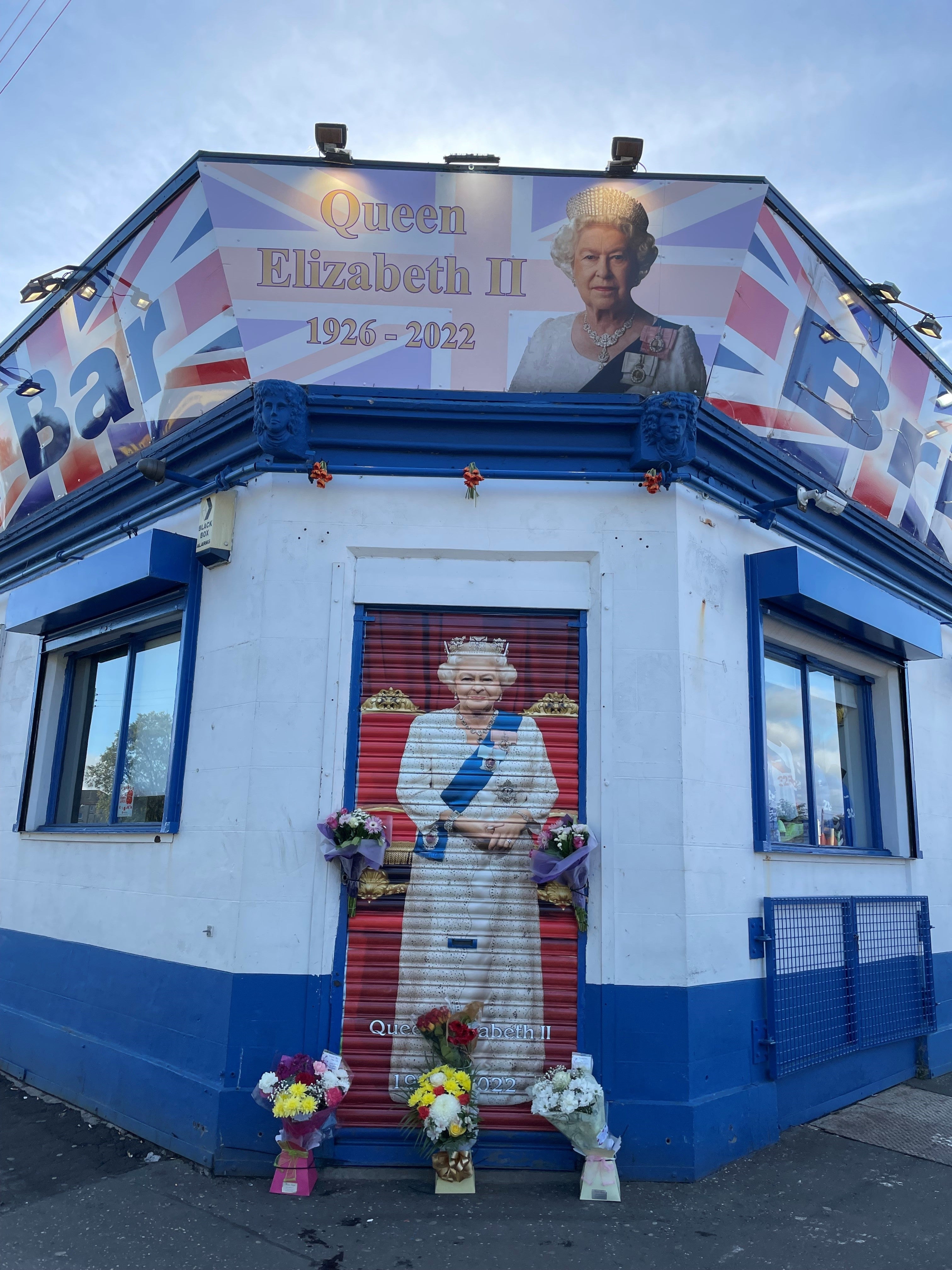 Flowers have been placed outside the pub’s shutters (PA)