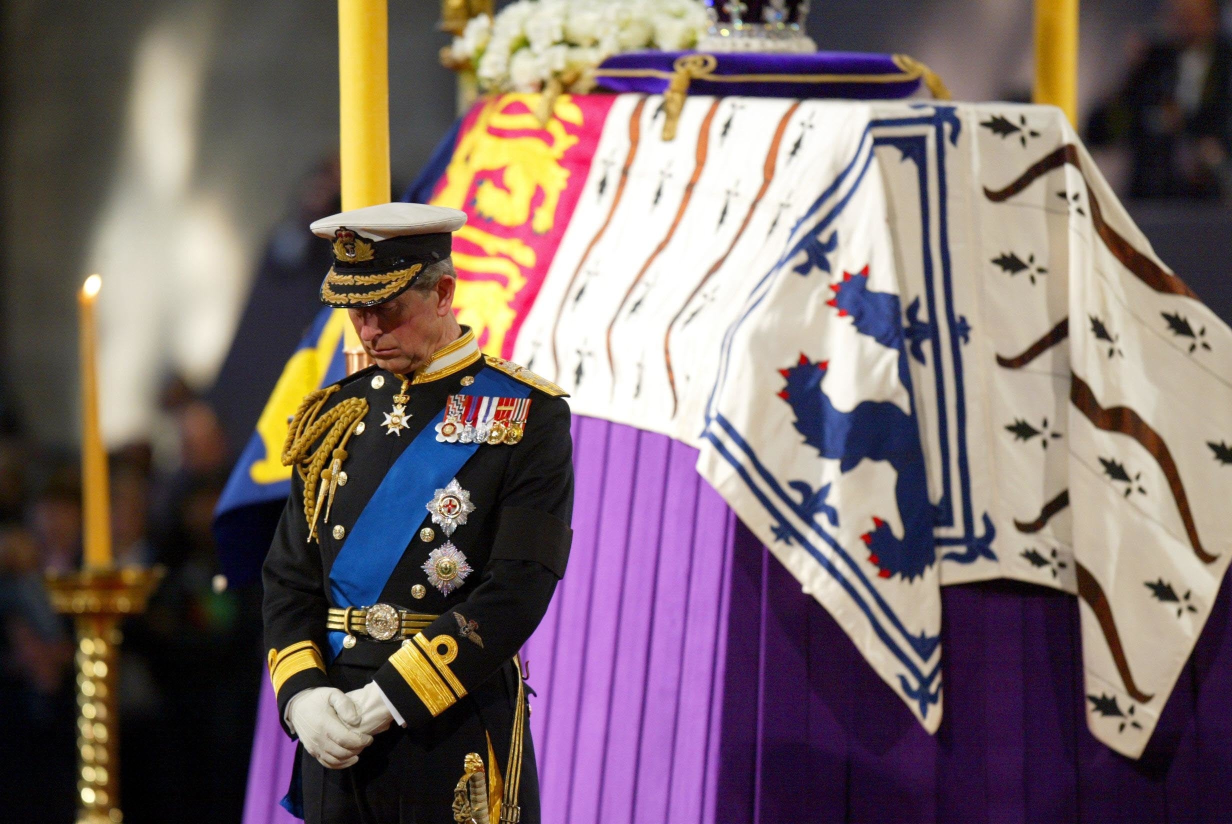 King Charles standing vigil beside the Queen Mother’s coffin while it lies-in-state at Westminster Hall in London, on the eve of her funeral at Westminster Abbey in 2002