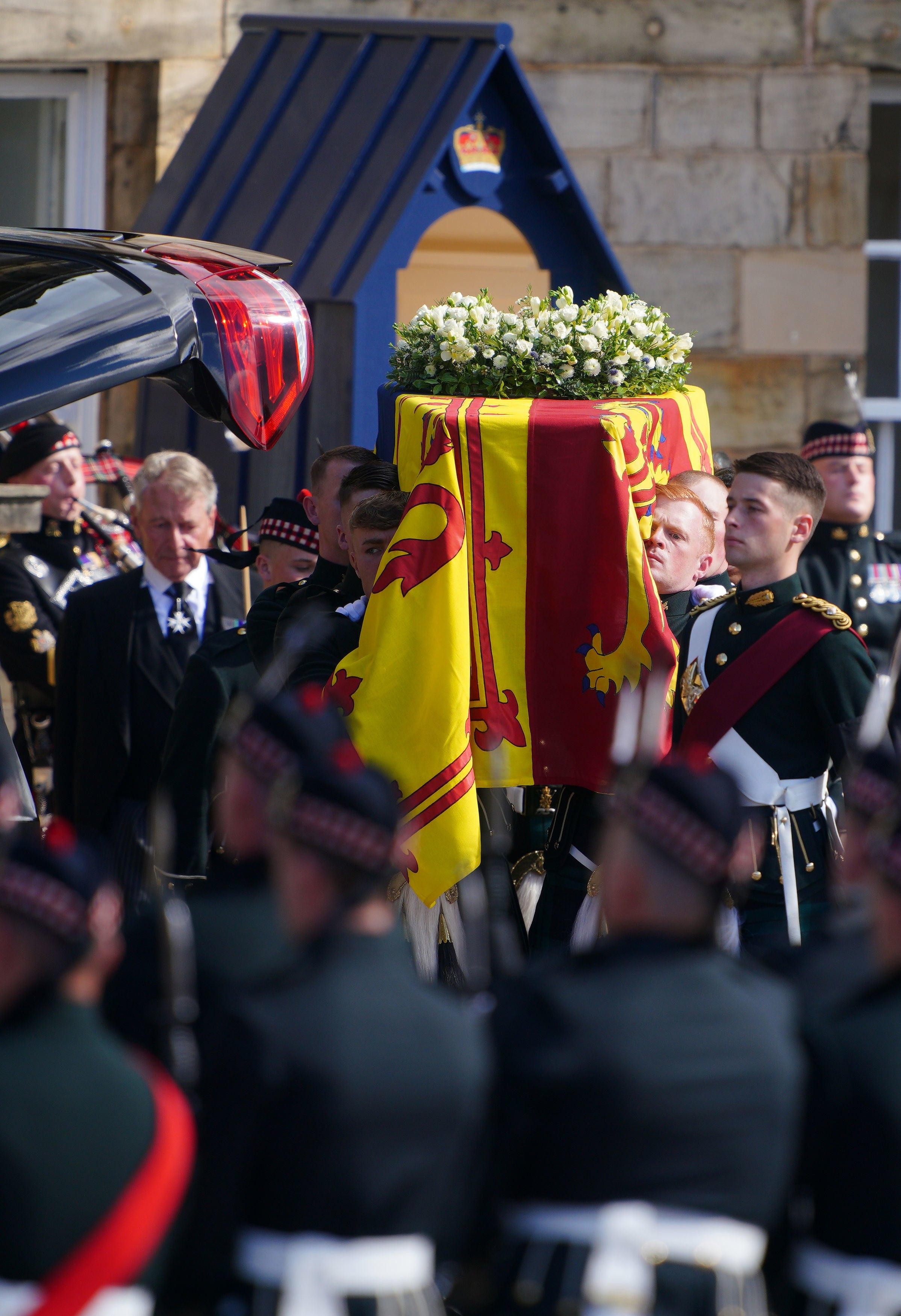 Royal guards carry Queen Elizabeth II's coffin at the start of the procession from the Palace of Holyroodhouse