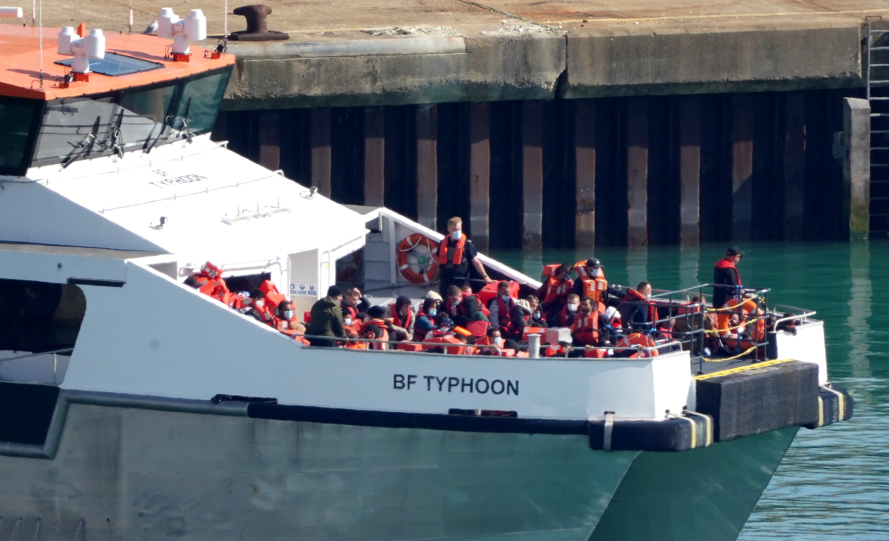 A group of people thought to be migrants are brought in to Dover, Kent, onboard a Border Force vessel following a small boat incident in the Channel (Gareth Fuller/PA)