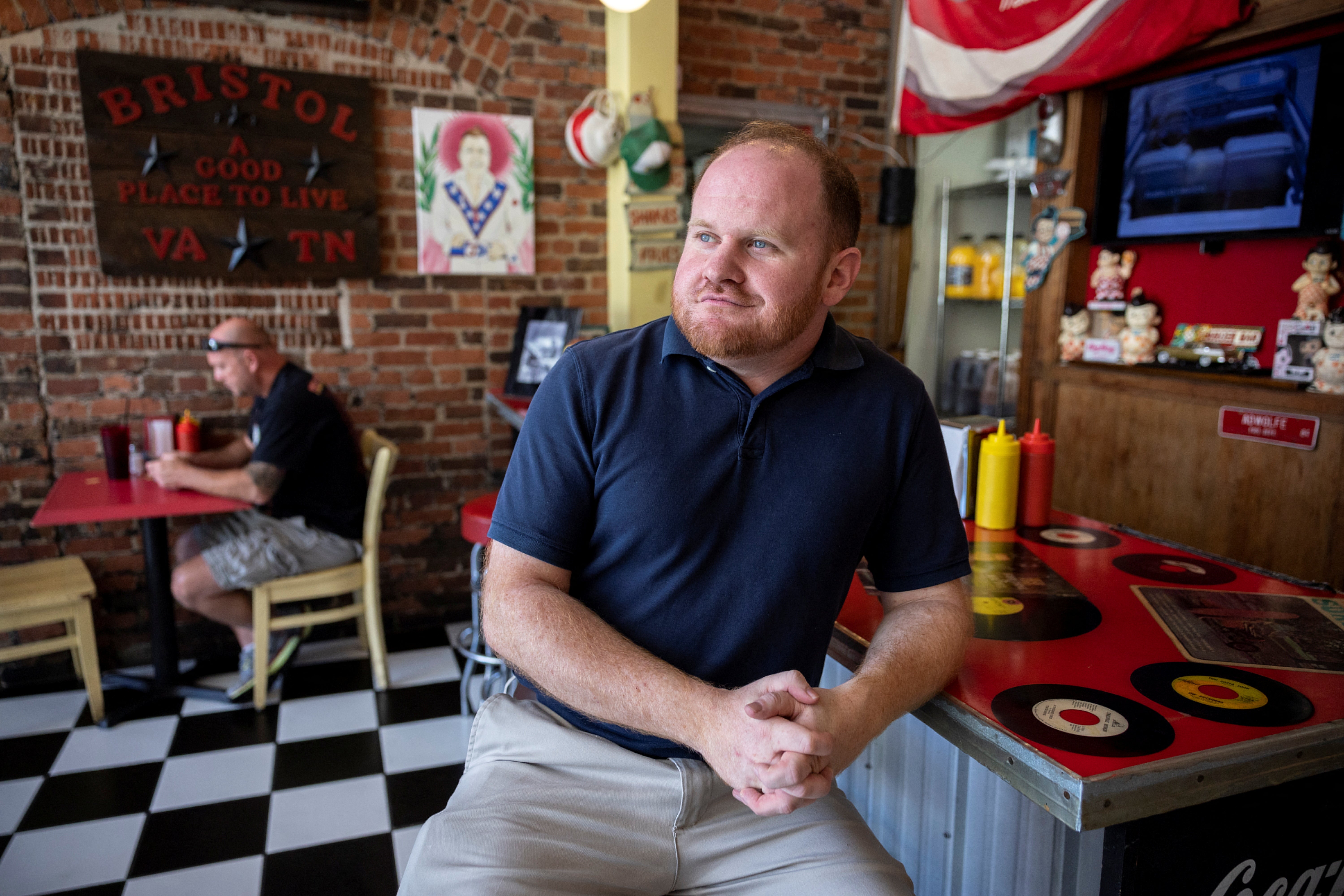 Anthony Farnum, the mayor of Bristol, Virginia, pose at the Burger Bar in Bristol, Virginia, U.S., September 1, 2022